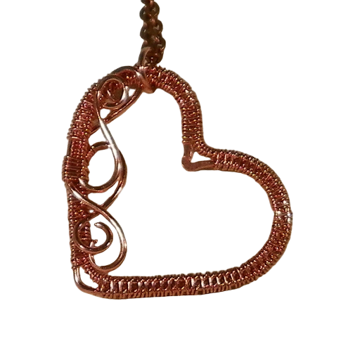 Dainty handmade copper heart featuring a tight wire weave. Can be worn as a pendant or used on a decorative bookmark. Handmade jewelry gifts.