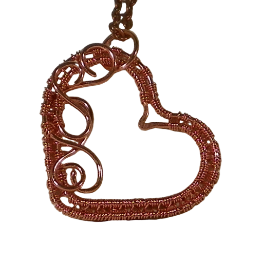 Lacey copper weave filigree heart pendant. Copper handmade jewelry that can be gifted, worn as a pendant or used on a decorative bookmark.