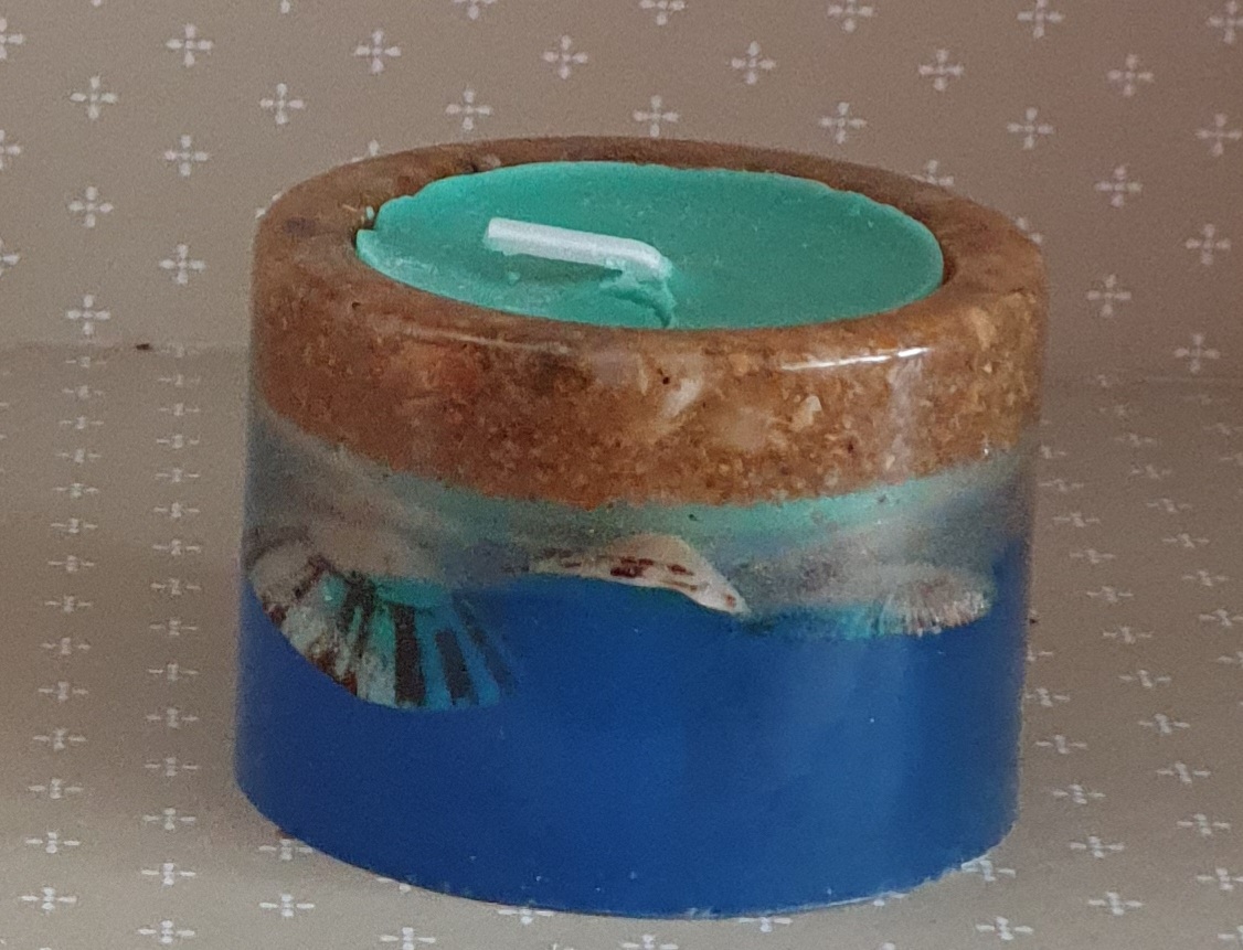 Porta velas efeito mar com areia e conchas