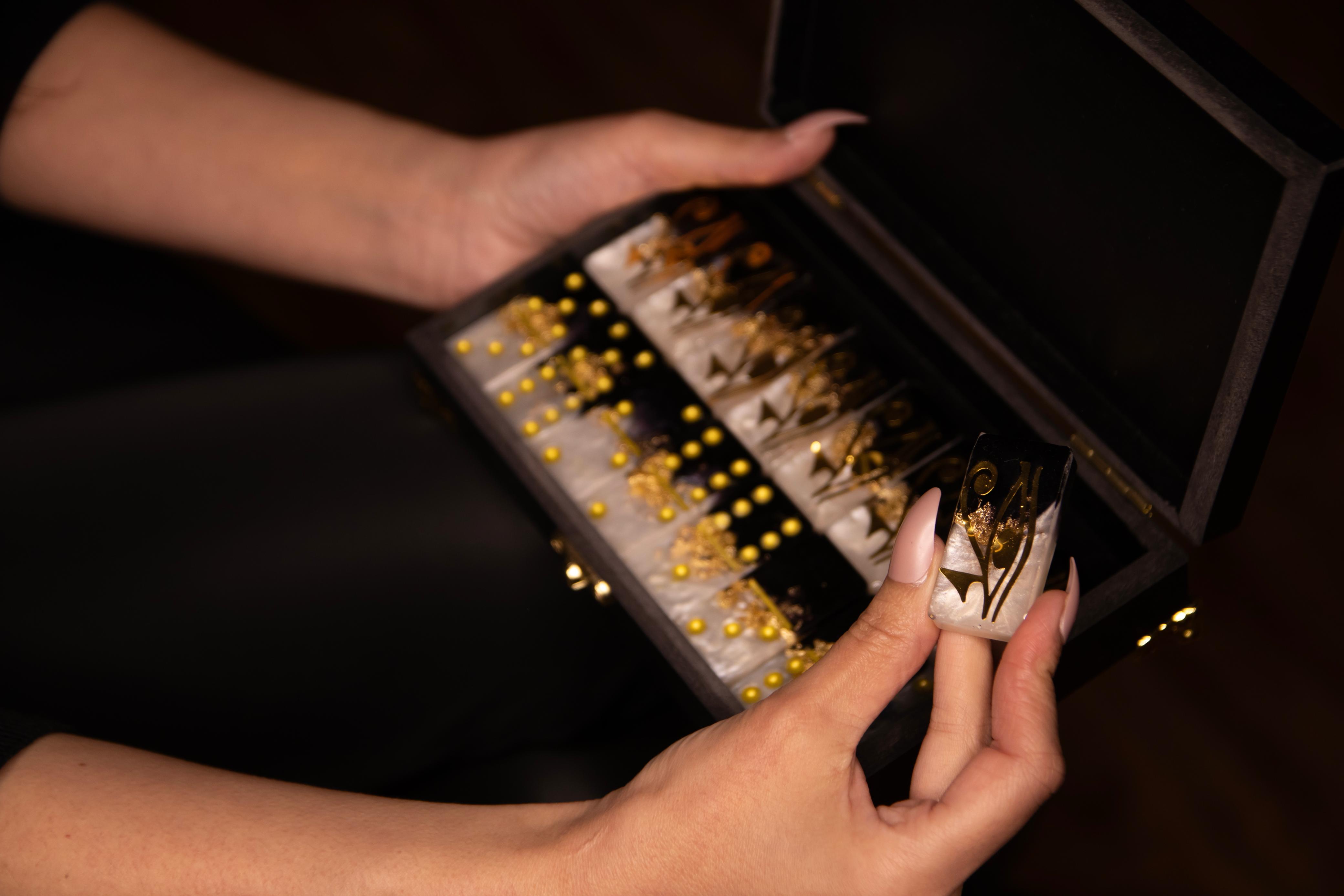 Domino gold with white and black, and the eye of Horus