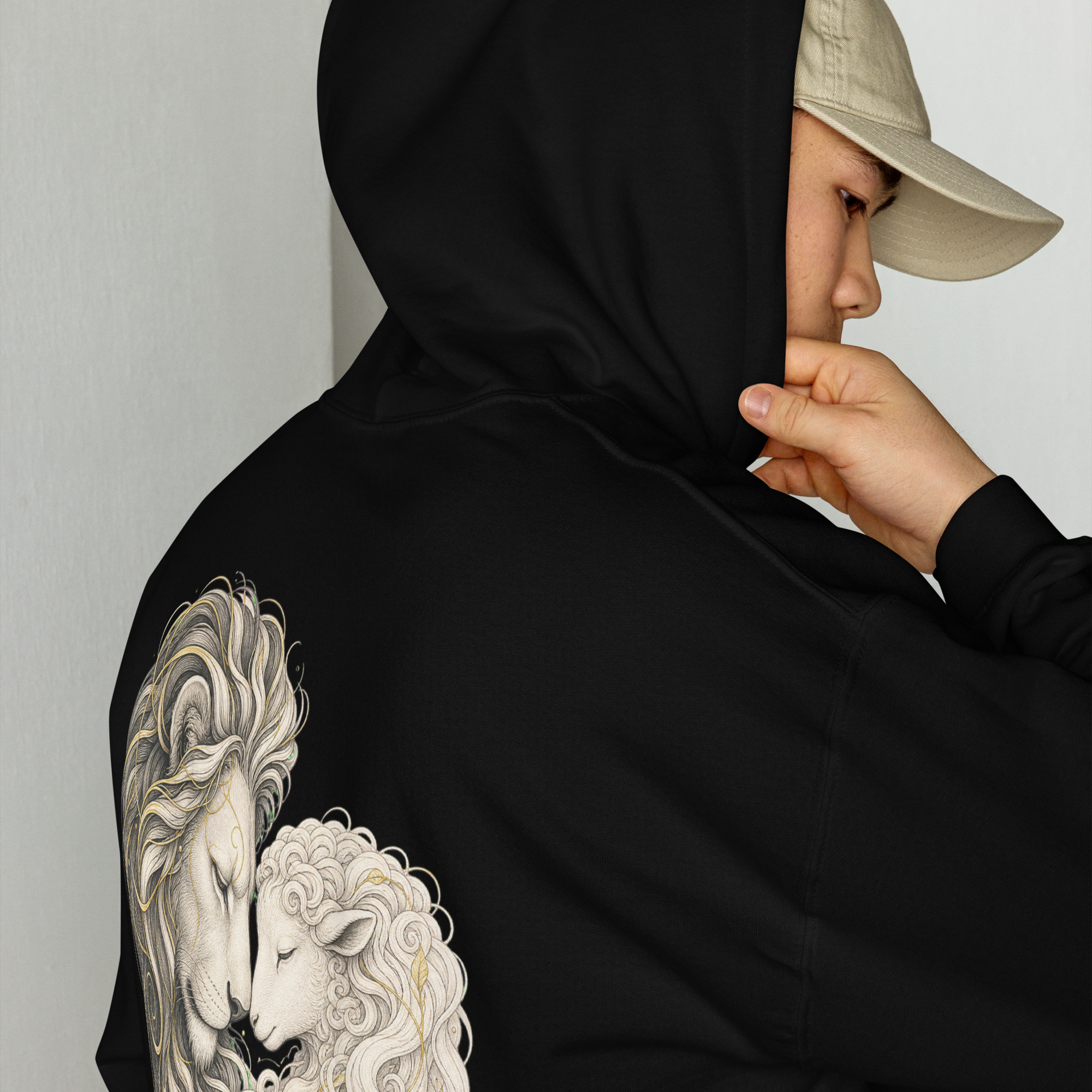 Lion & the Lamb Heart Faith Black Hoodie with an embroidered cross at the wrist area of each sleeve