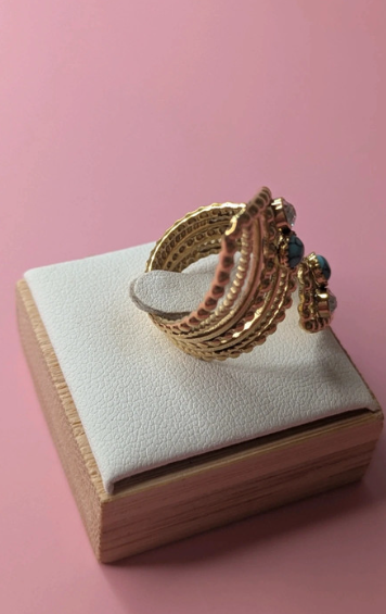 Anello regolabile dorato con pietre turchesi