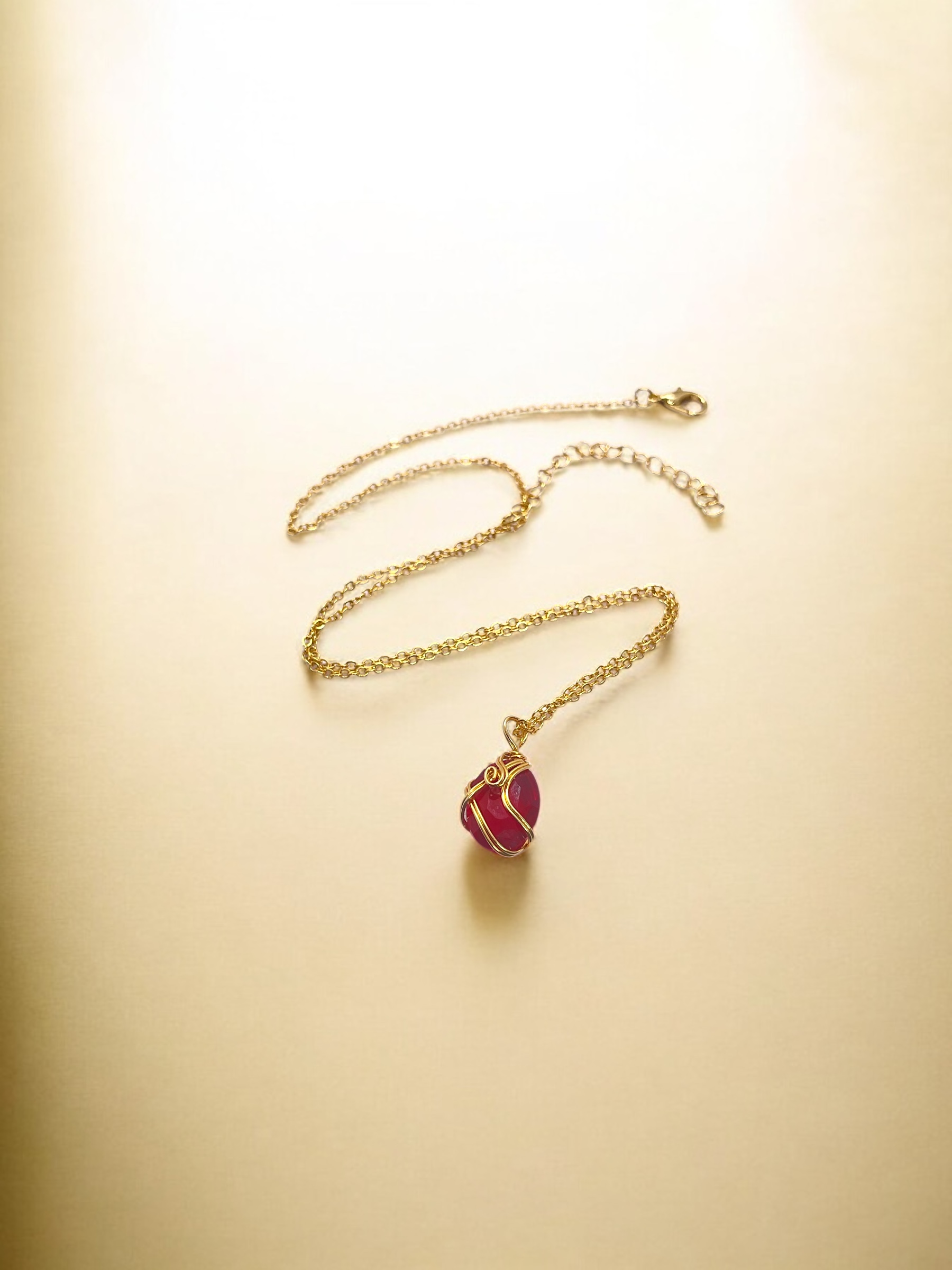 Gold Necklace with Red Gem Pendant