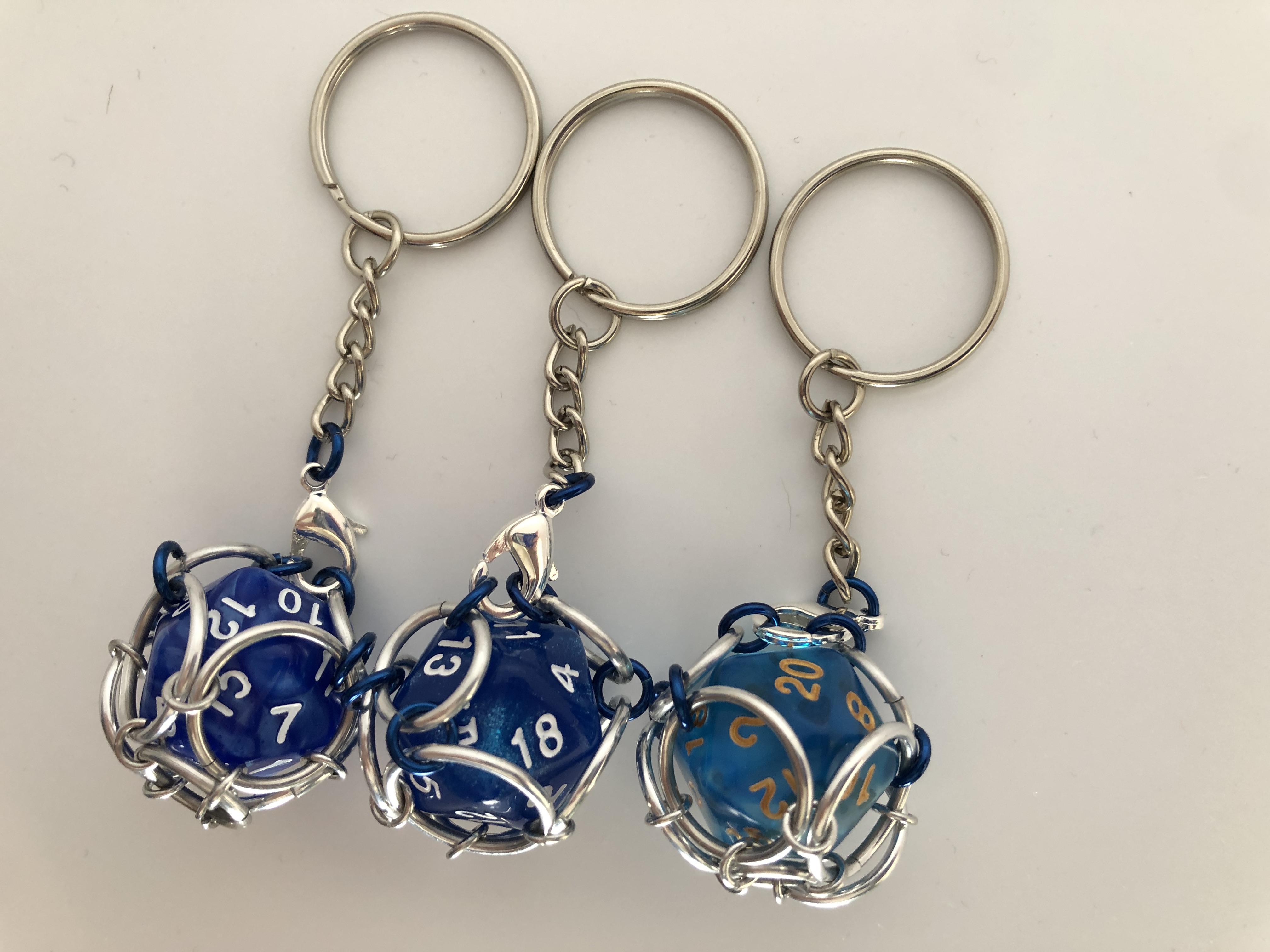 Playable Caged d20 Keychains--Blue