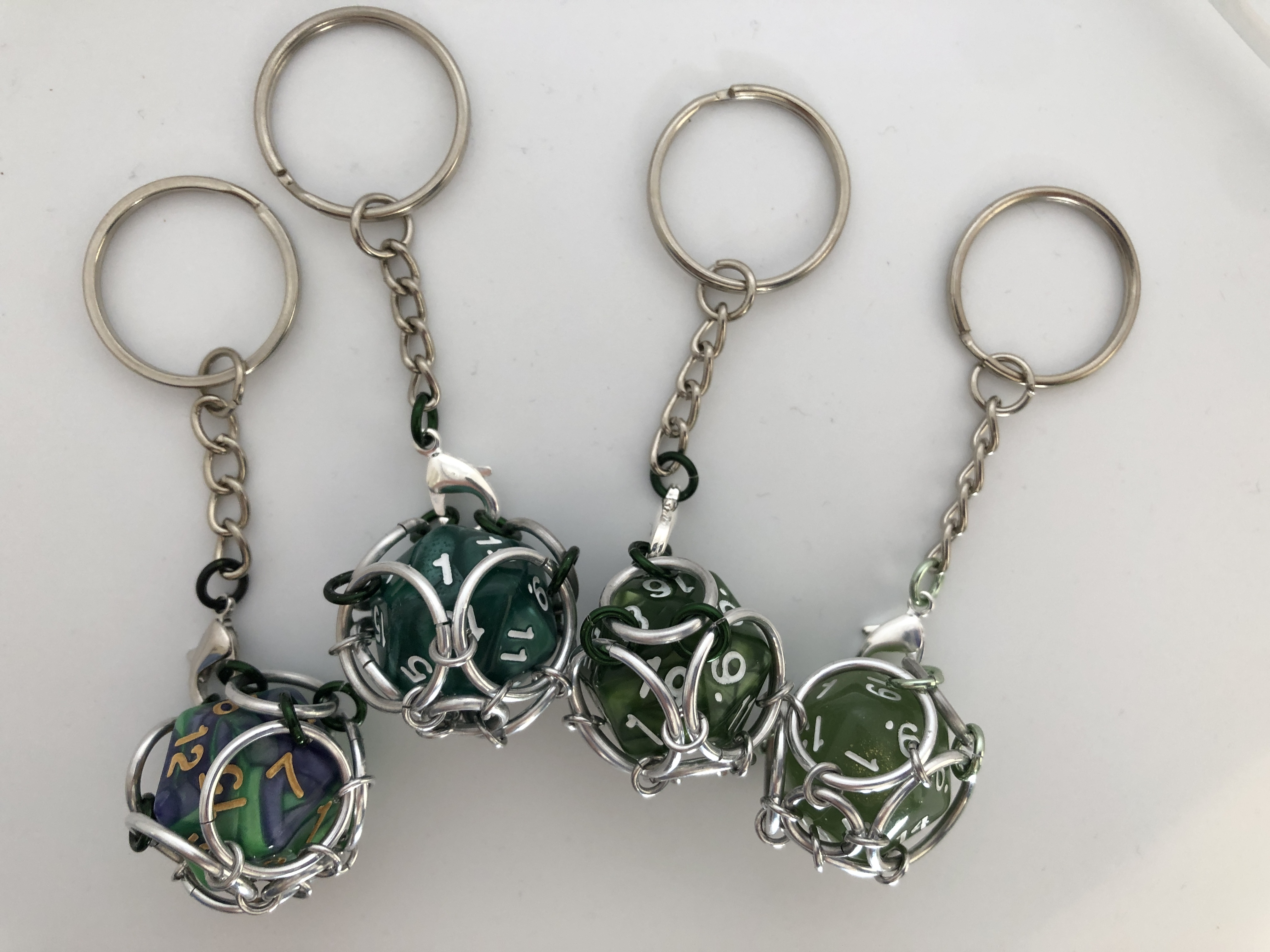 Playable Caged d20 Keychains--Muted Greens