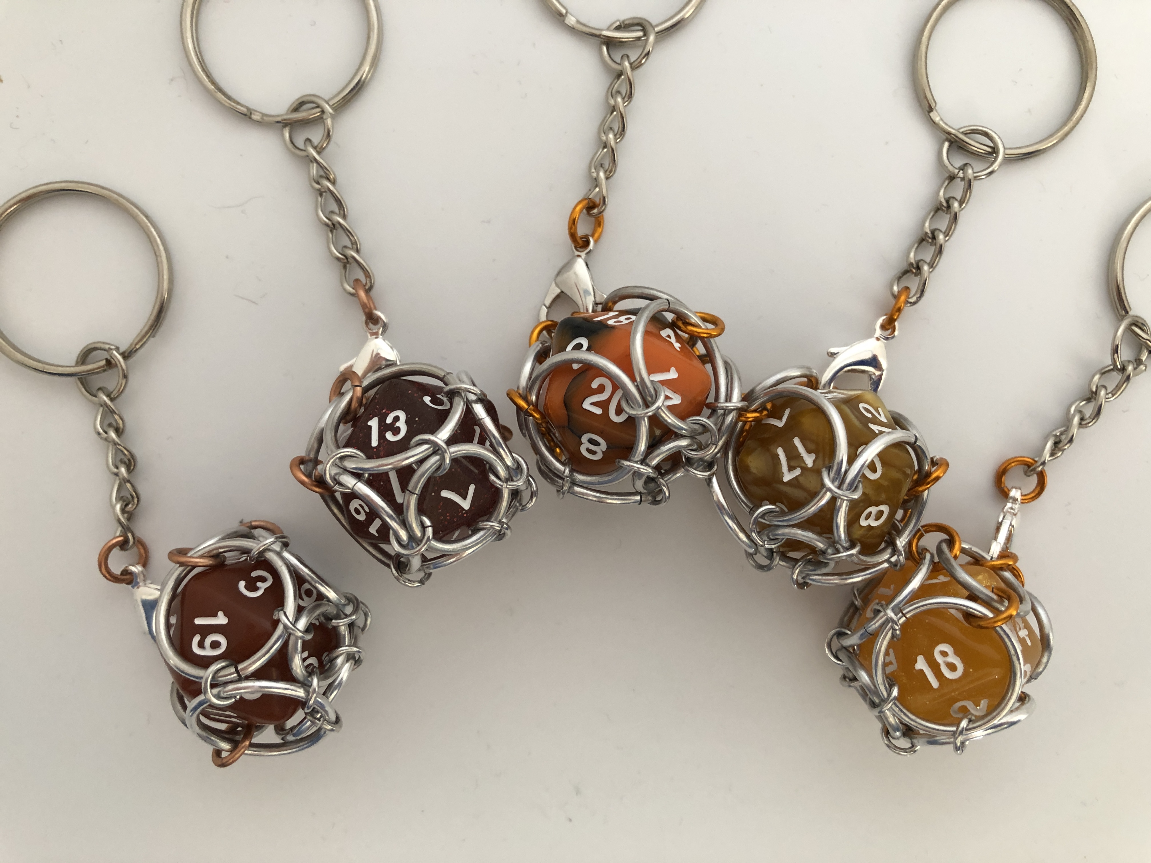 Playable Caged d20 Keychains--Orange & Brown