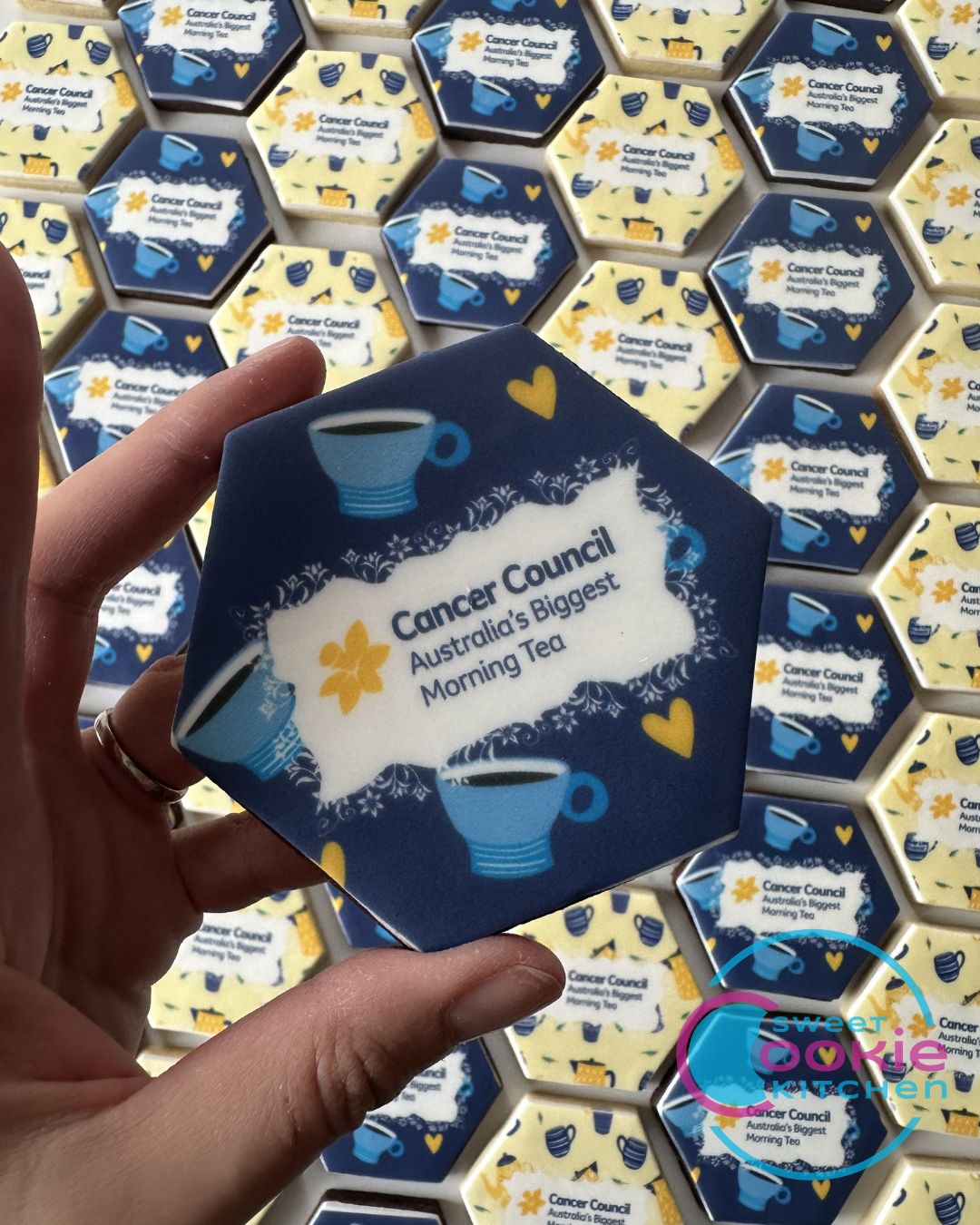 Hexagon Biggest Morning Tea Cookies: Cancer Council logo