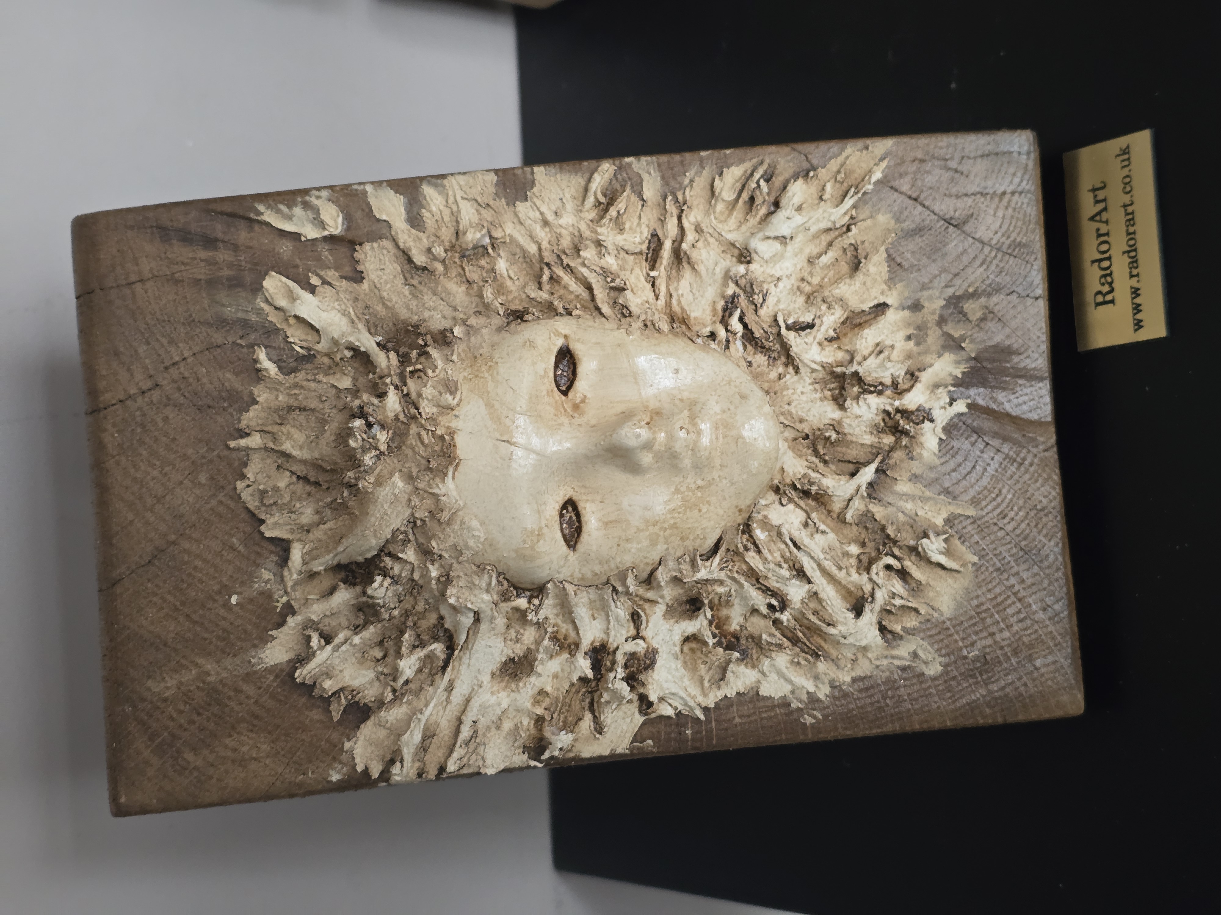 Handcrafted Wooden face on the wood