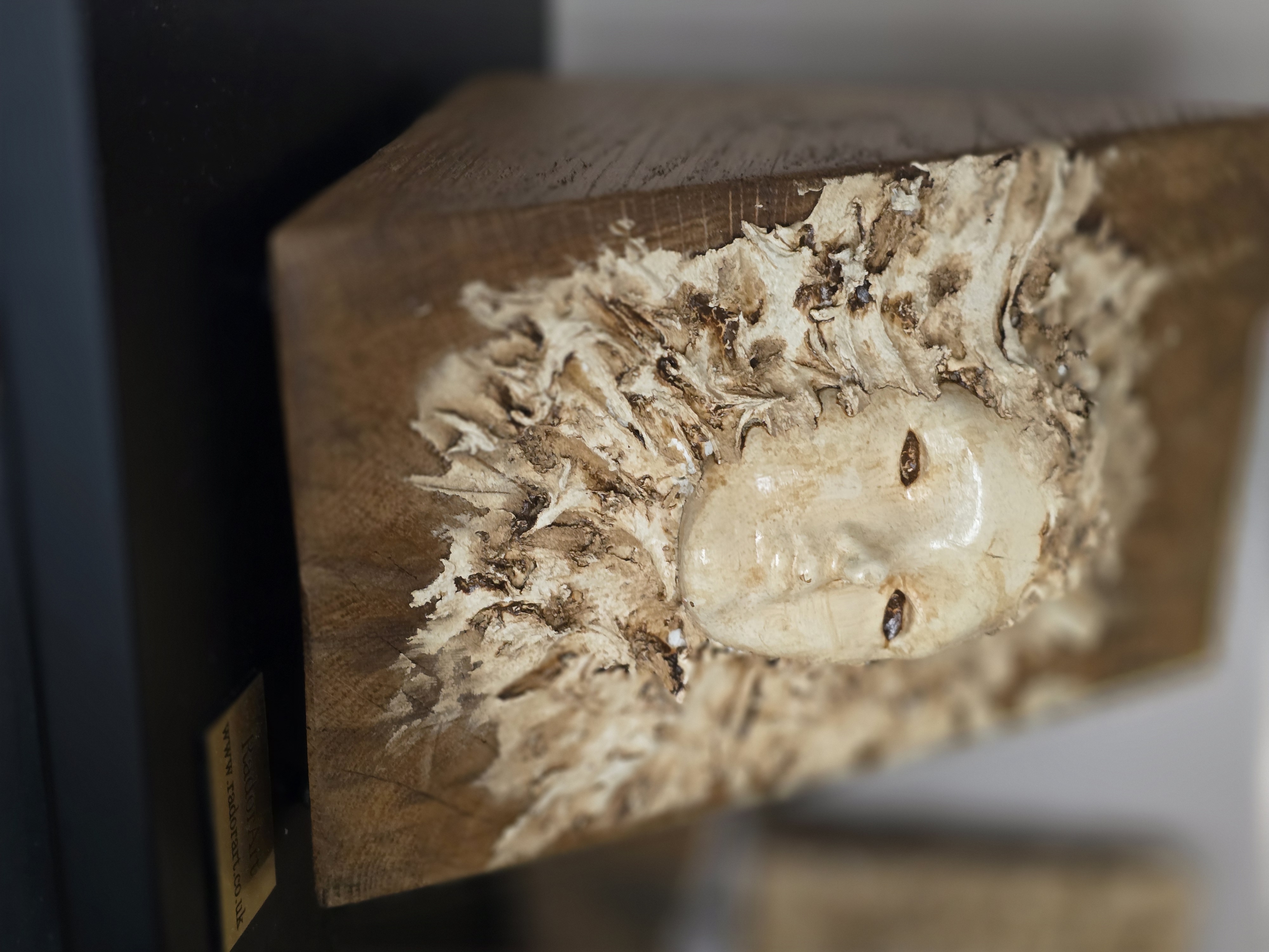 Handcrafted Wooden face on the wood