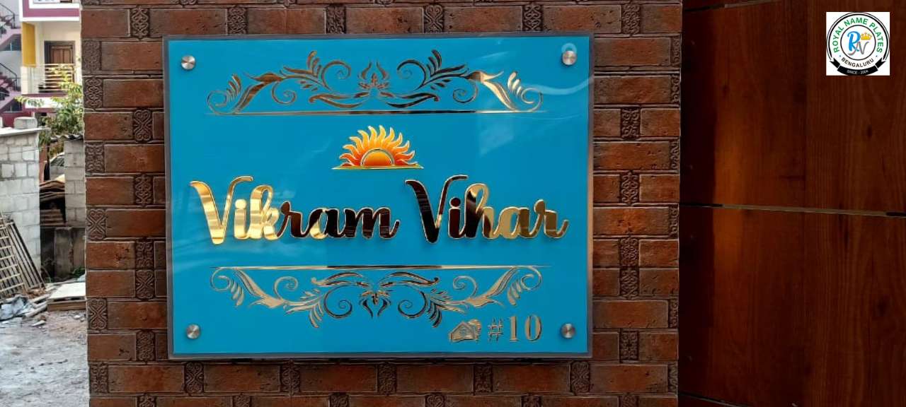 Illuminated Blue Acrylic Name Plate – Golden Embossed Text & Rising Sun