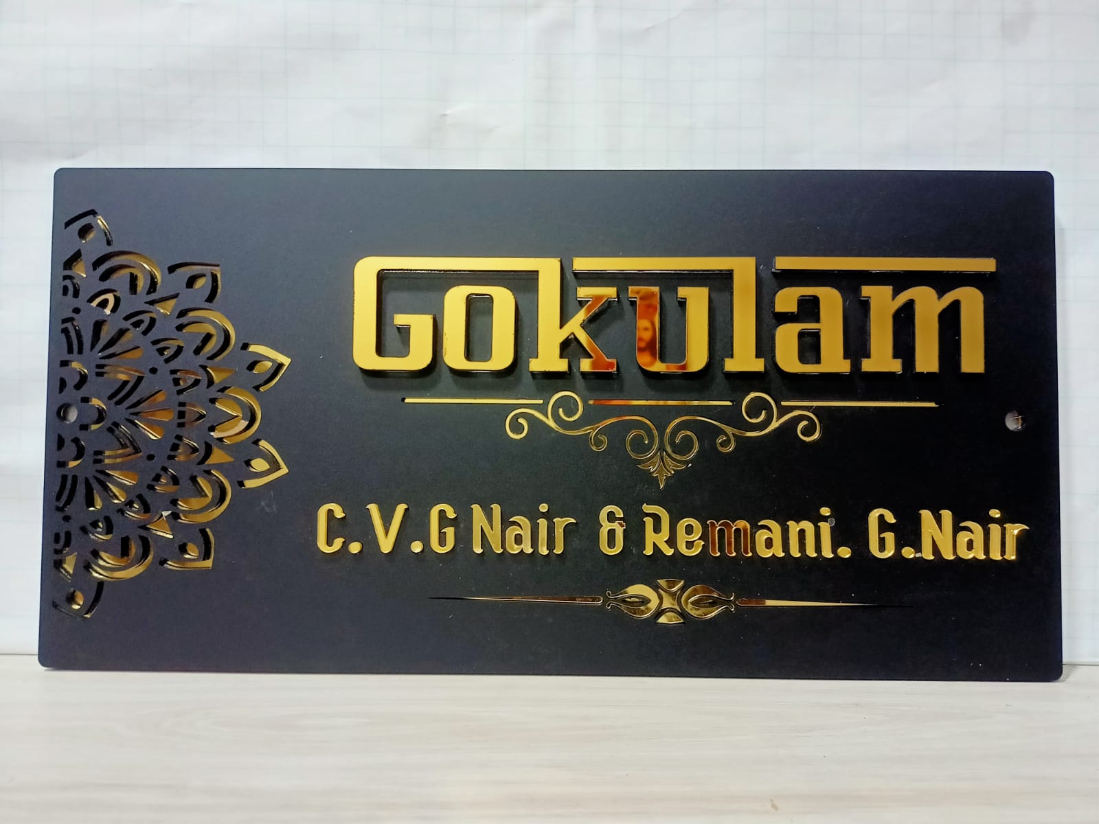 "Matte Black Acrylic House Name Plate with Golden Text & Geometric Design "