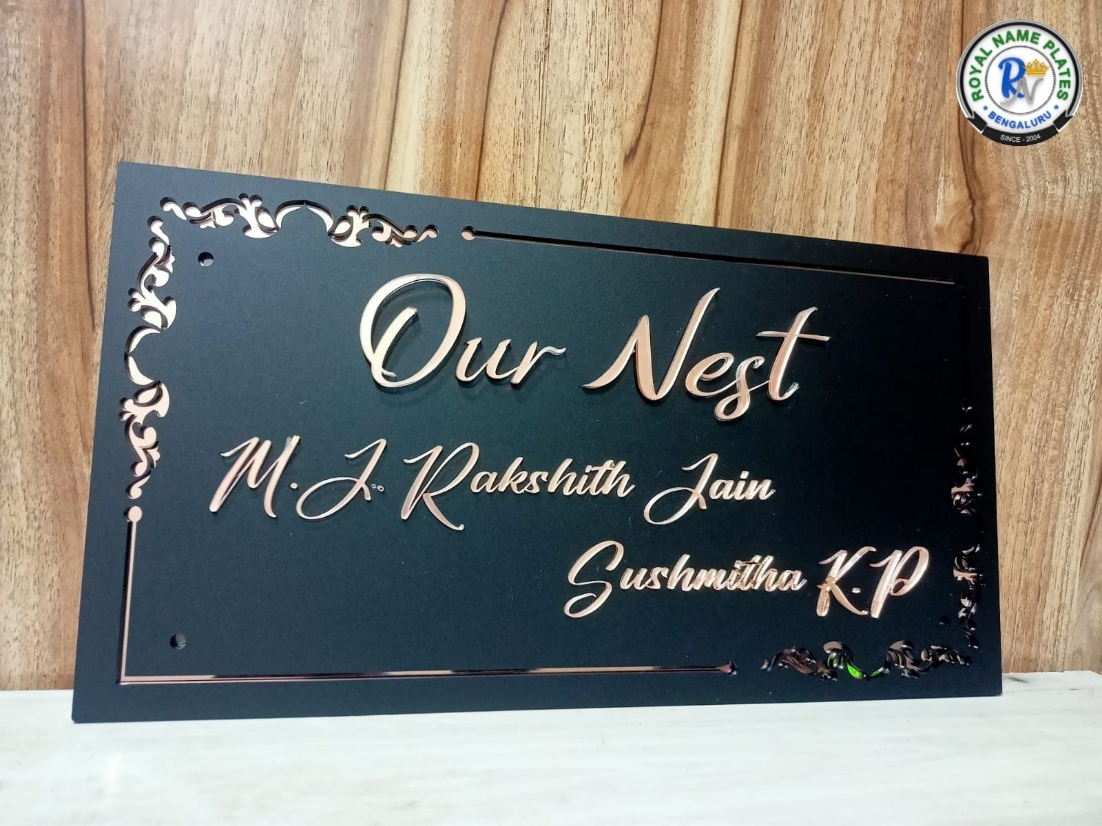 Matte Black Acrylic House Name Plate – Copper Rising Text with Side Floral Design