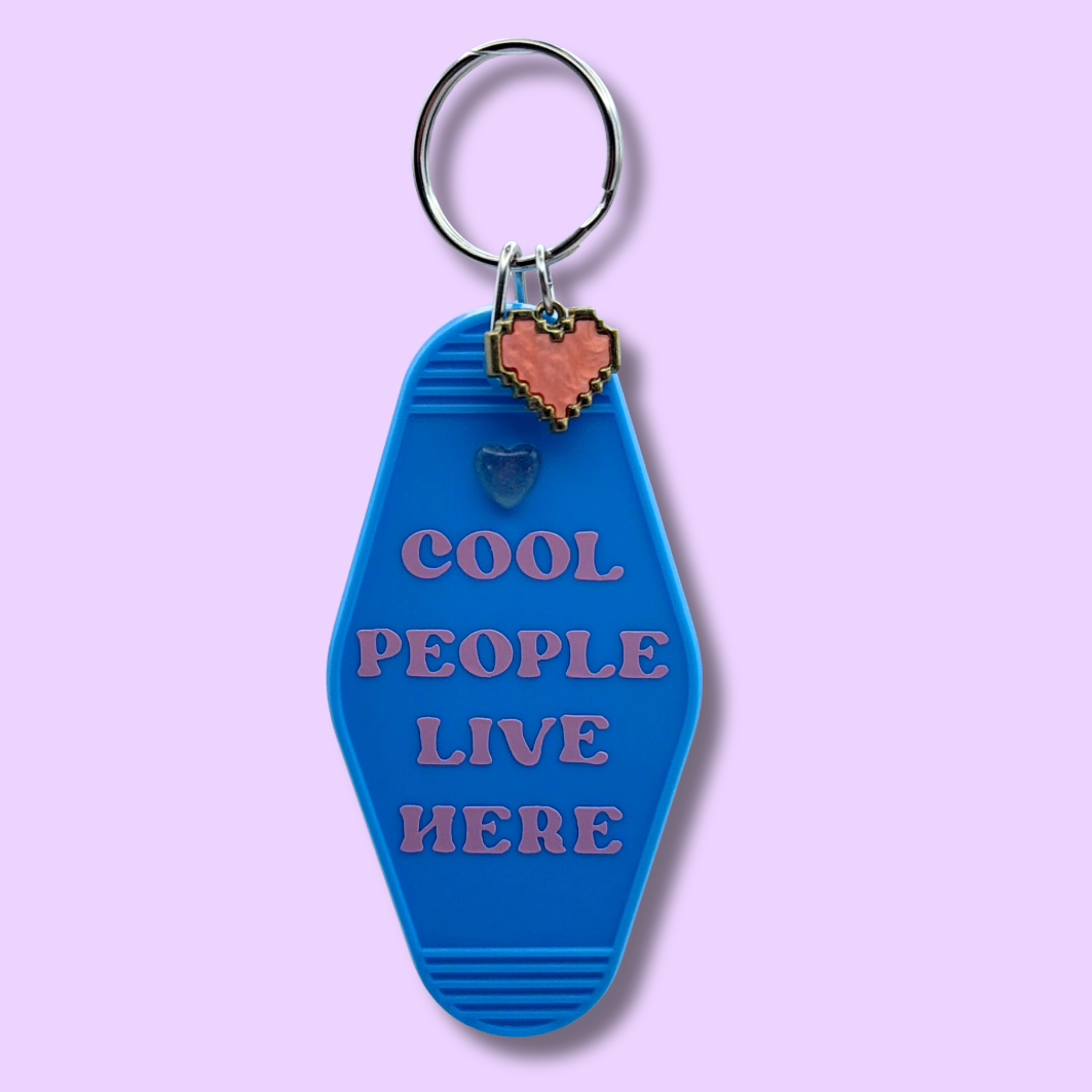 Cool People Live Here Blue Heart Motel Keychain