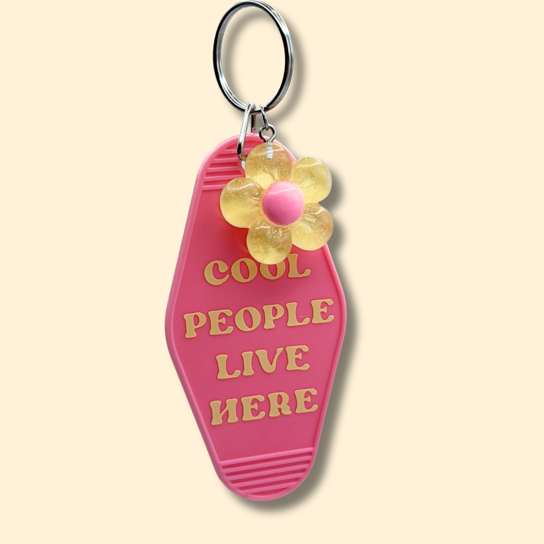 Cool People Live Here Pink Flower Motel Keychain