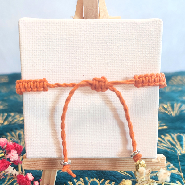 Bracelet macramé orange avec 3 bijoux pression interchangeables