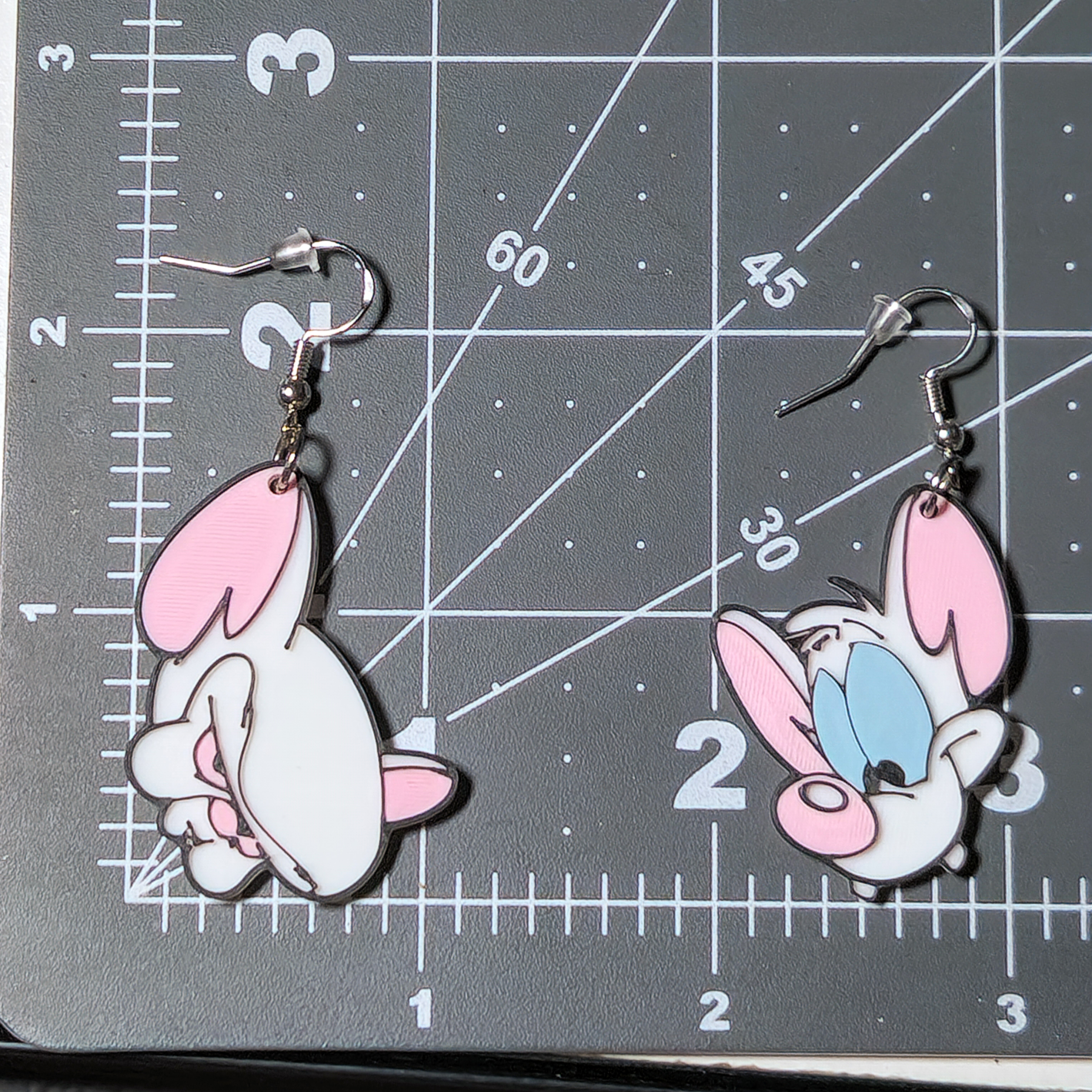 Pinky and the Brain Earrings 3D Printed with Holograms on the Back