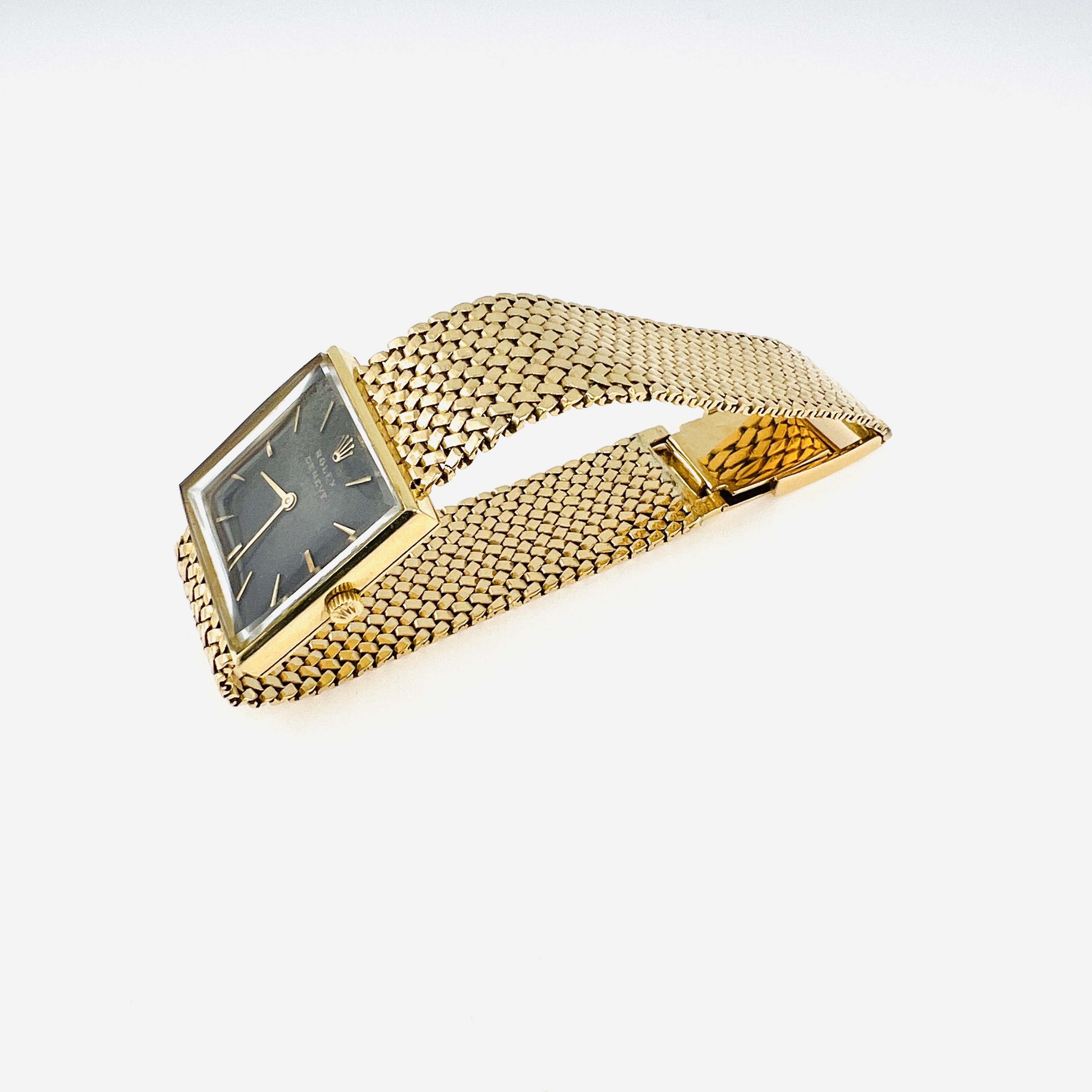 Vintage Rolex mechnical watch in 18K gold case and mesh bracelet band