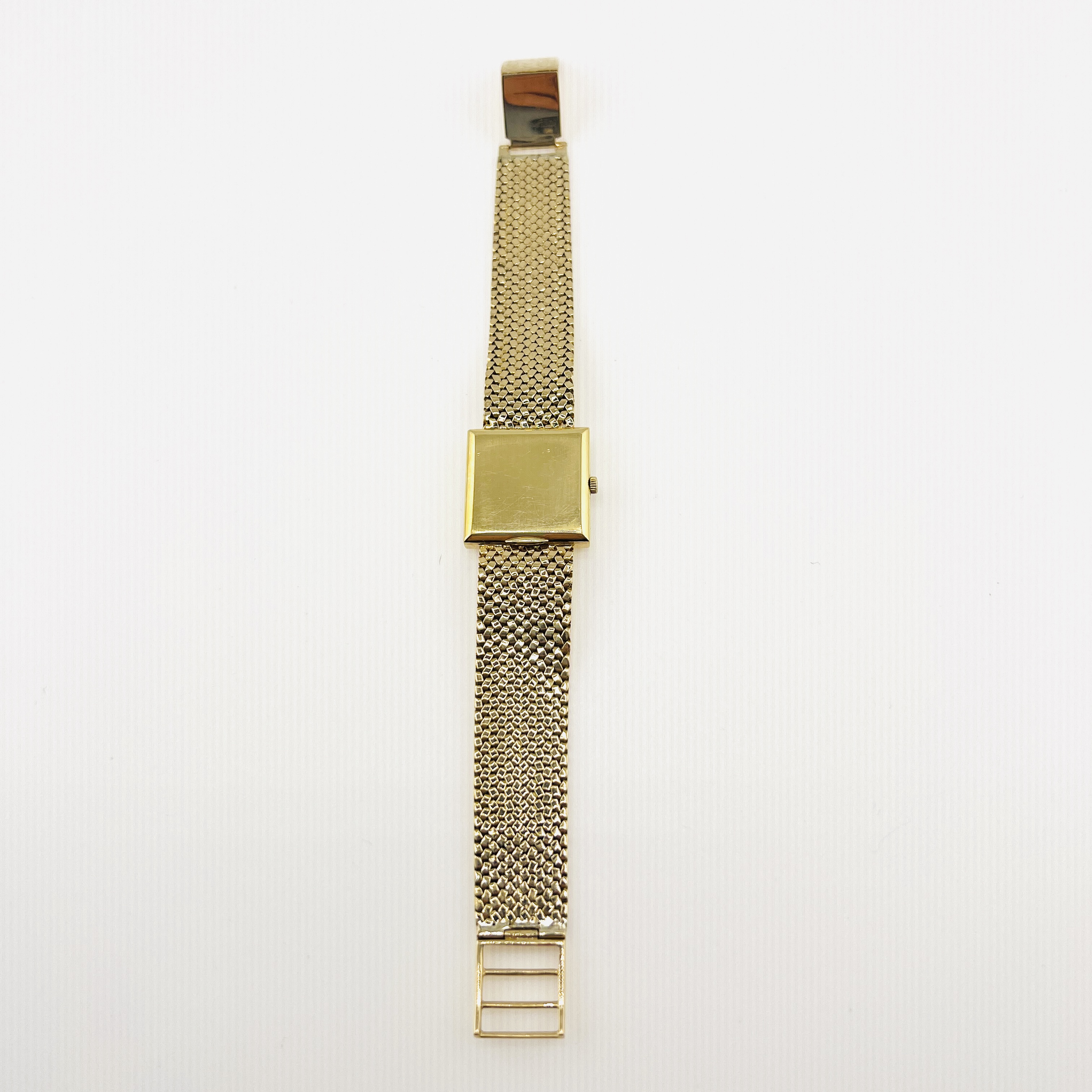 Vintage Rolex mechnical watch in 18K gold case and mesh bracelet band