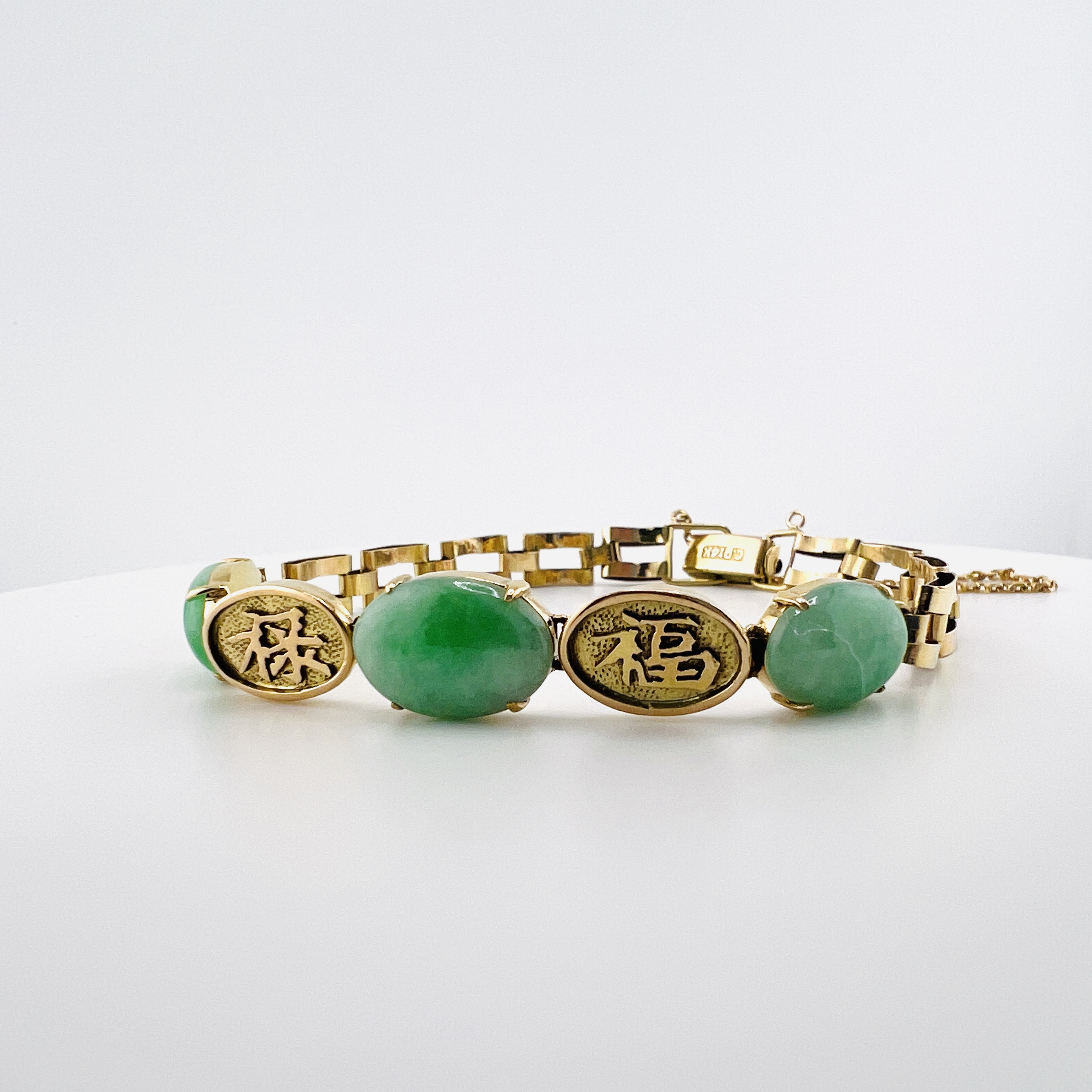 Natural green jadeite cabochon link bracelet in 18K gold
