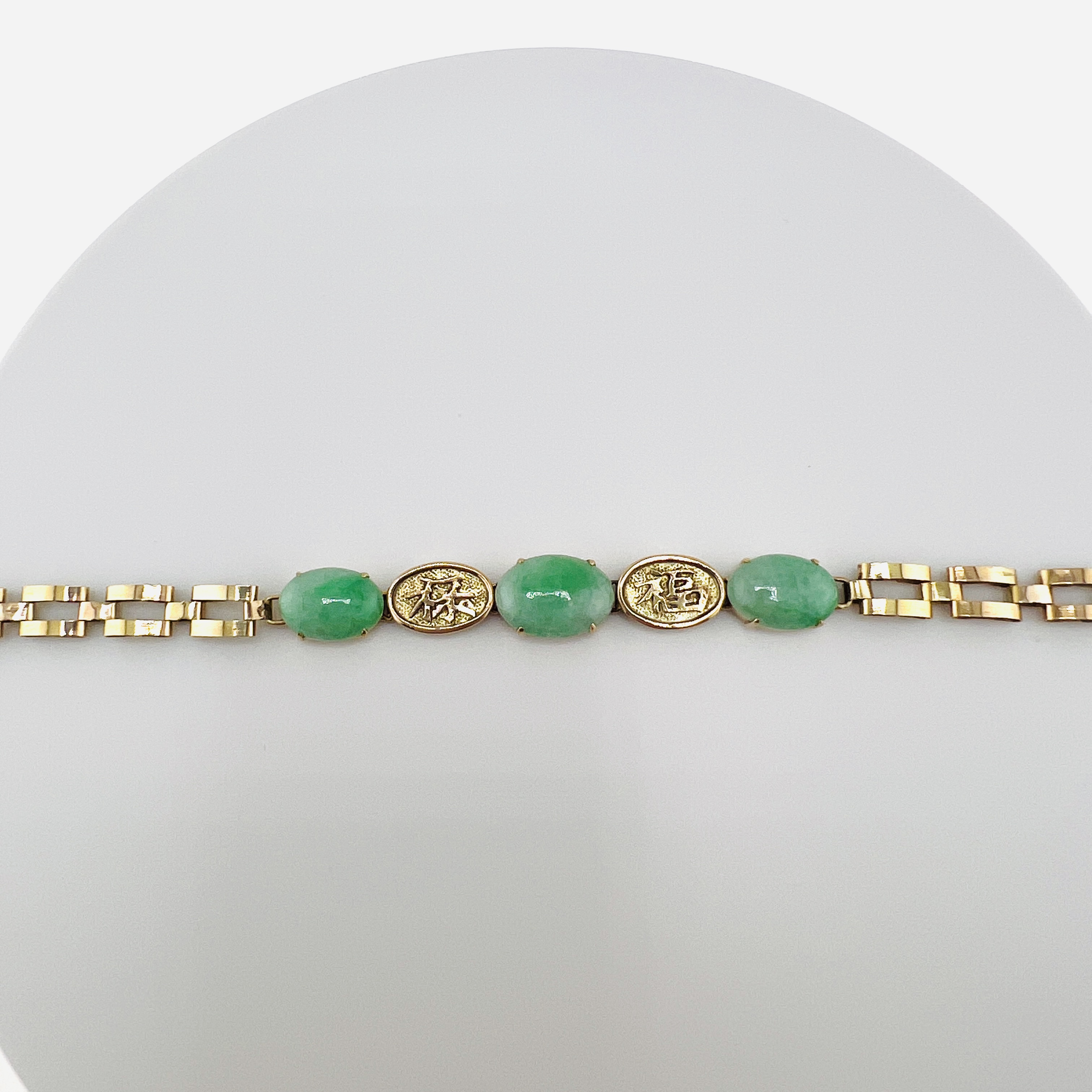 Natural green jadeite cabochon link bracelet in 18K gold