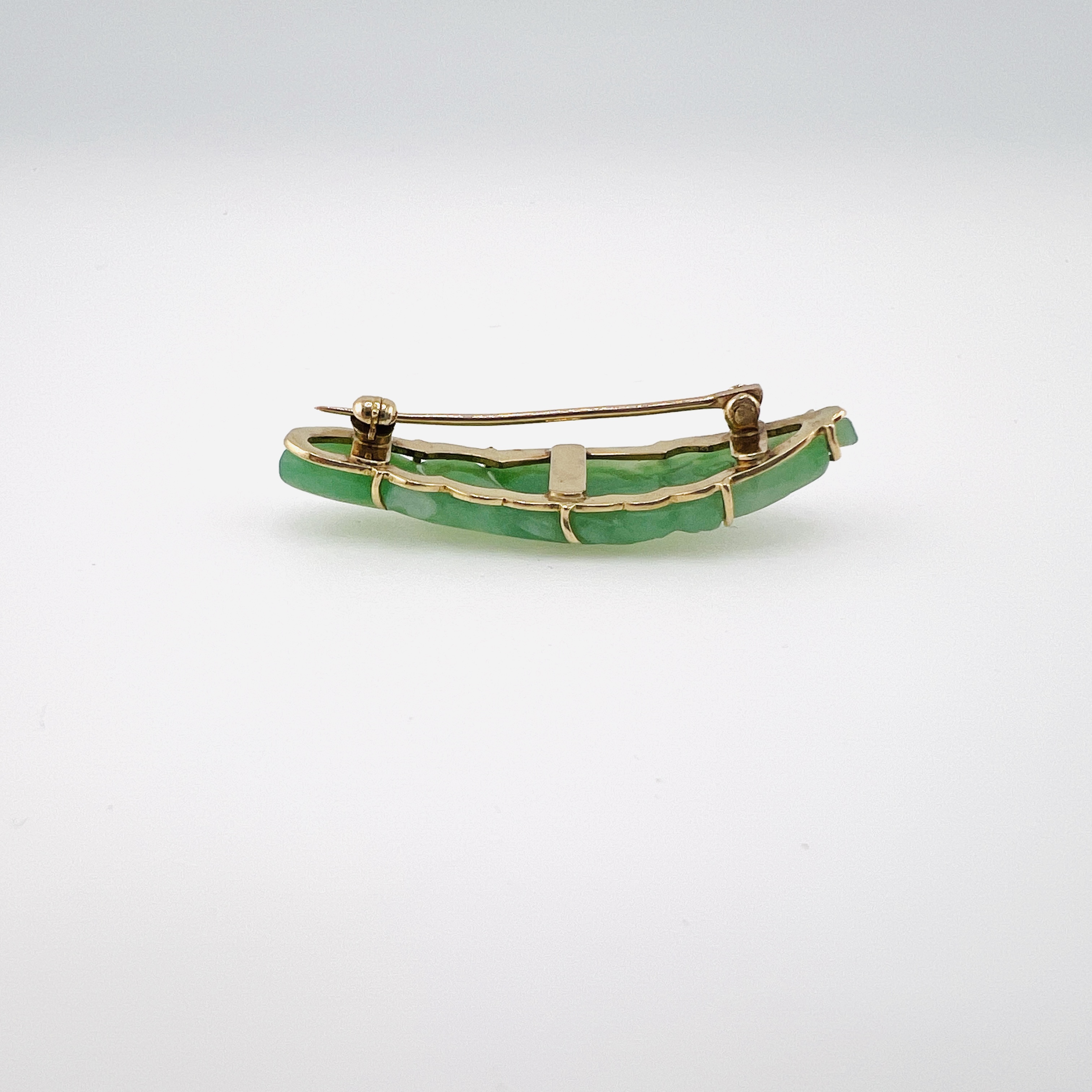 Antique green jadeite fish brooch in gold setting