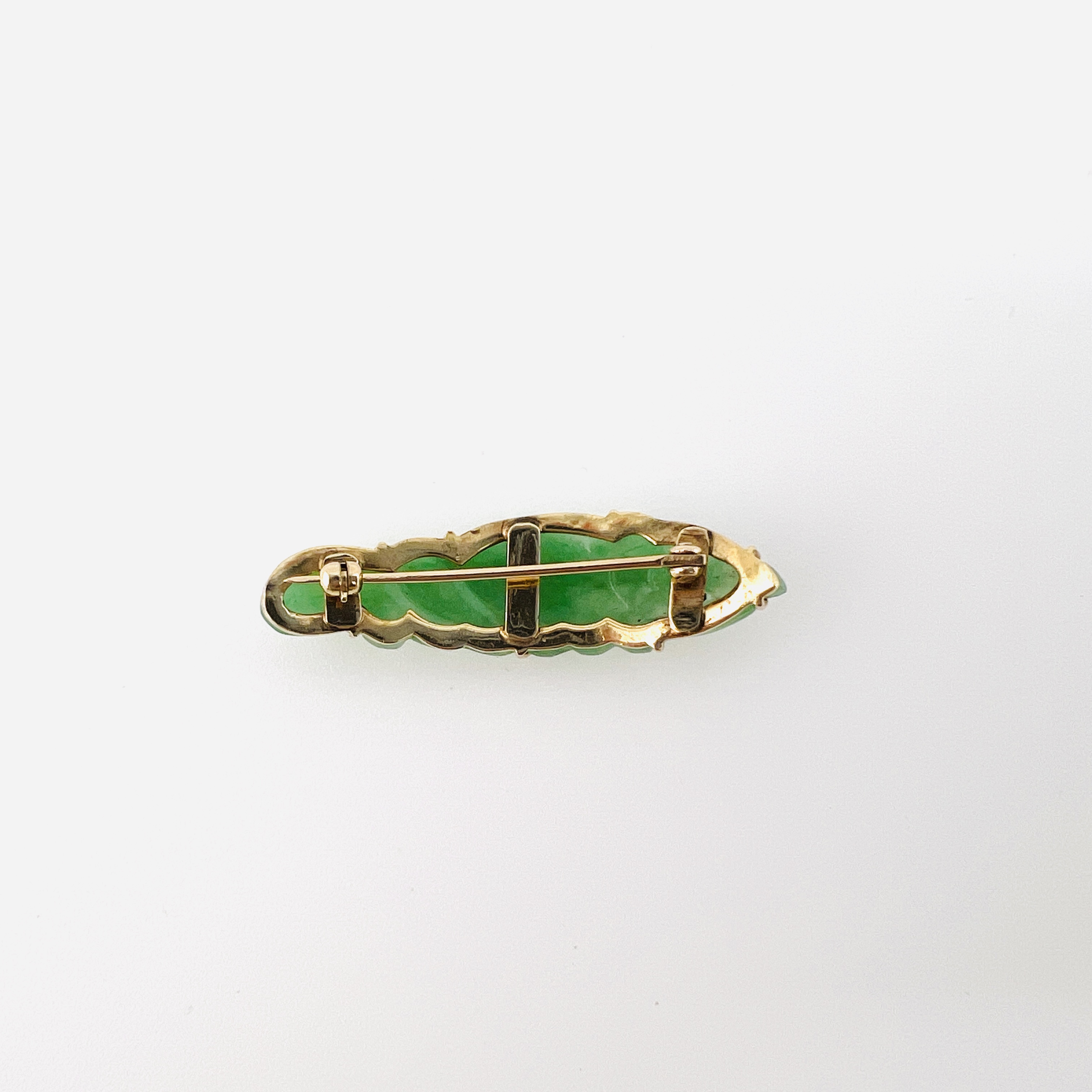 Antique green jadeite fish brooch in gold setting