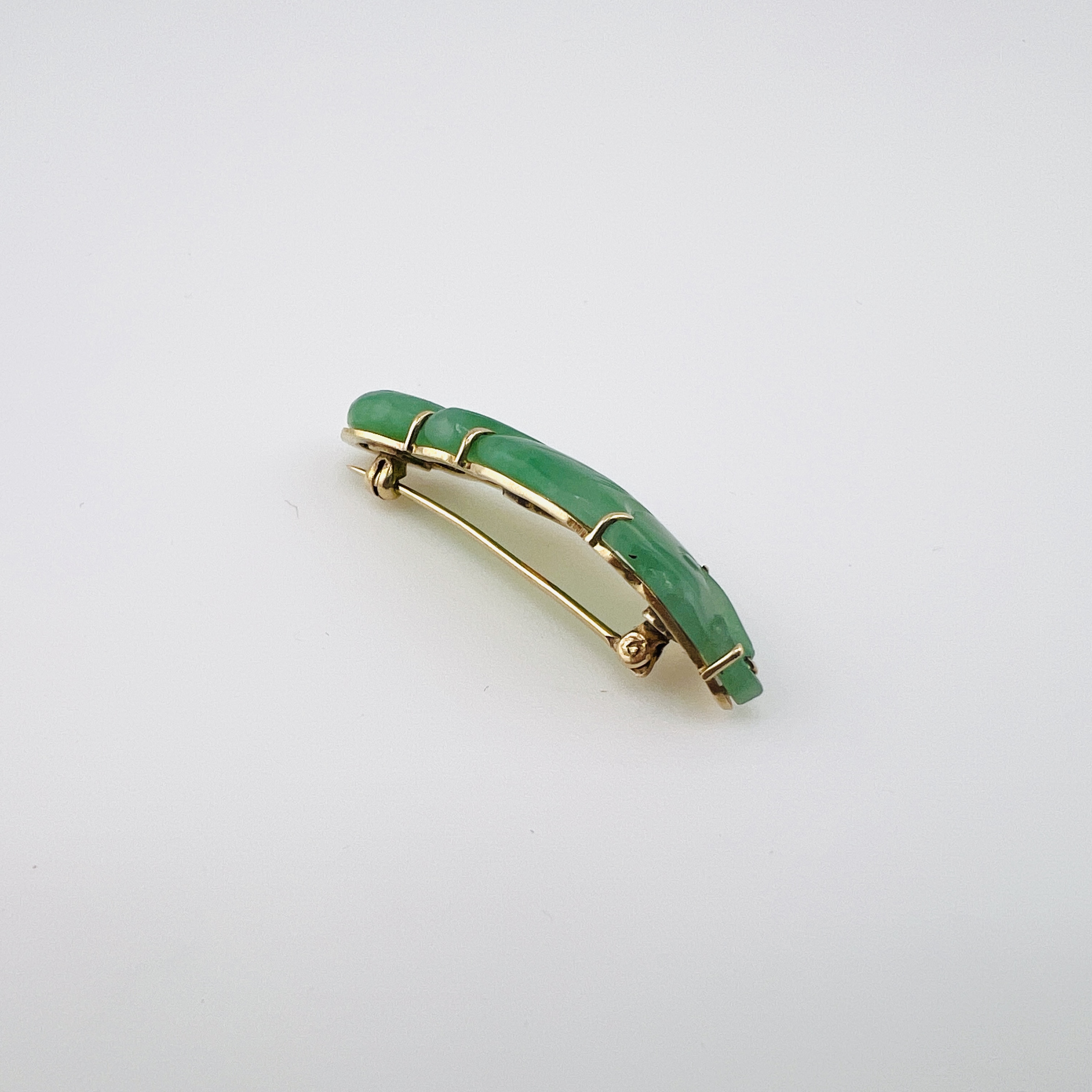 Antique green jadeite fish brooch in gold setting