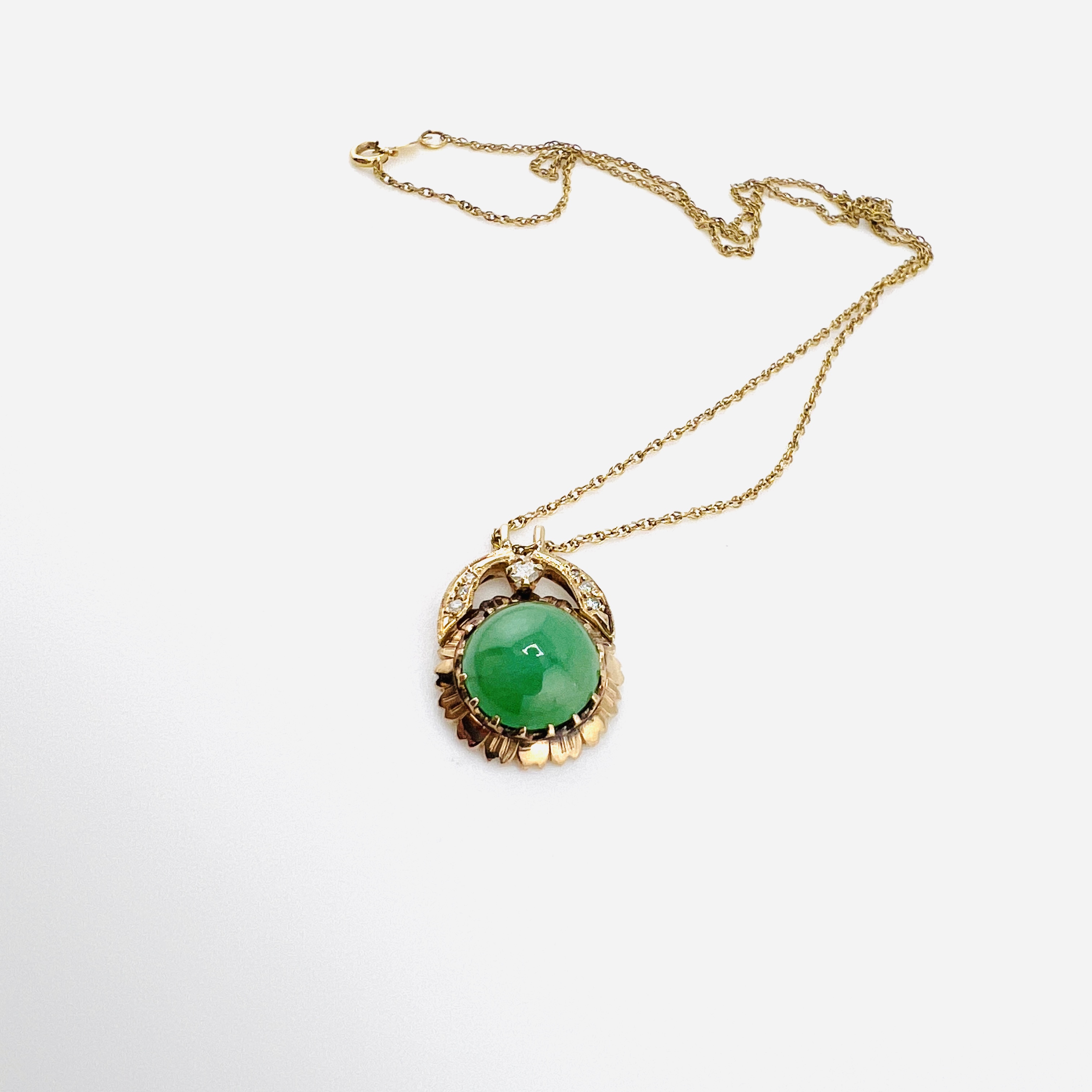 Vintage green jadeite cabochon and diamonds in a 14K gold chain necklace