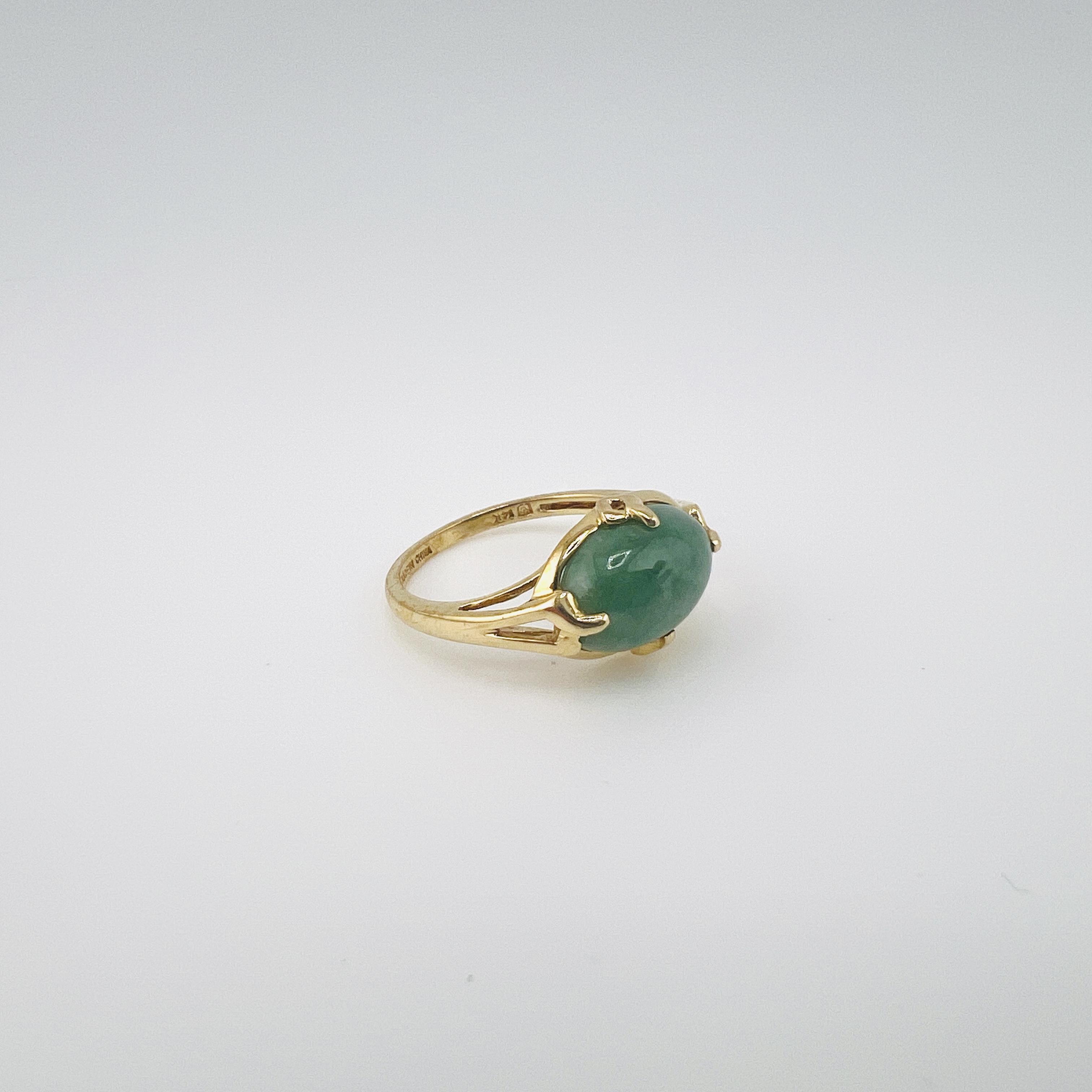 Green jadeite cabochon ring in 14K gold