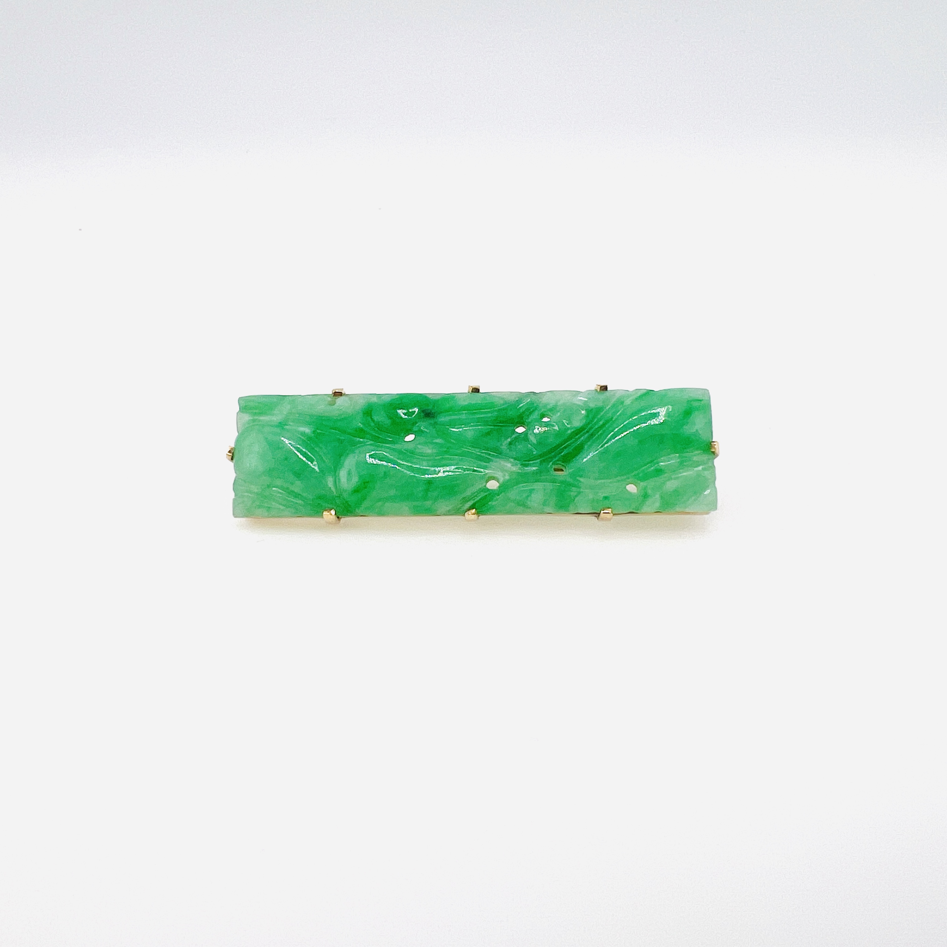 Green jadeite bar brooch in gold setting