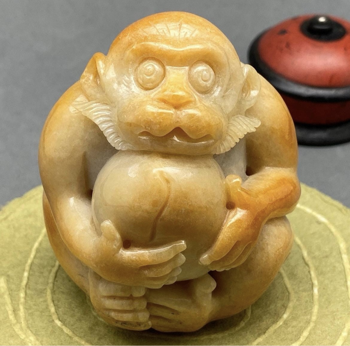 Yellow jadeite monkey and peach sculpture, collectible