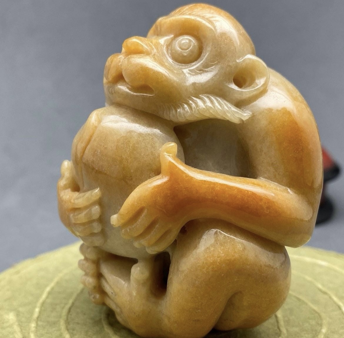 Yellow jadeite monkey and peach sculpture, collectible