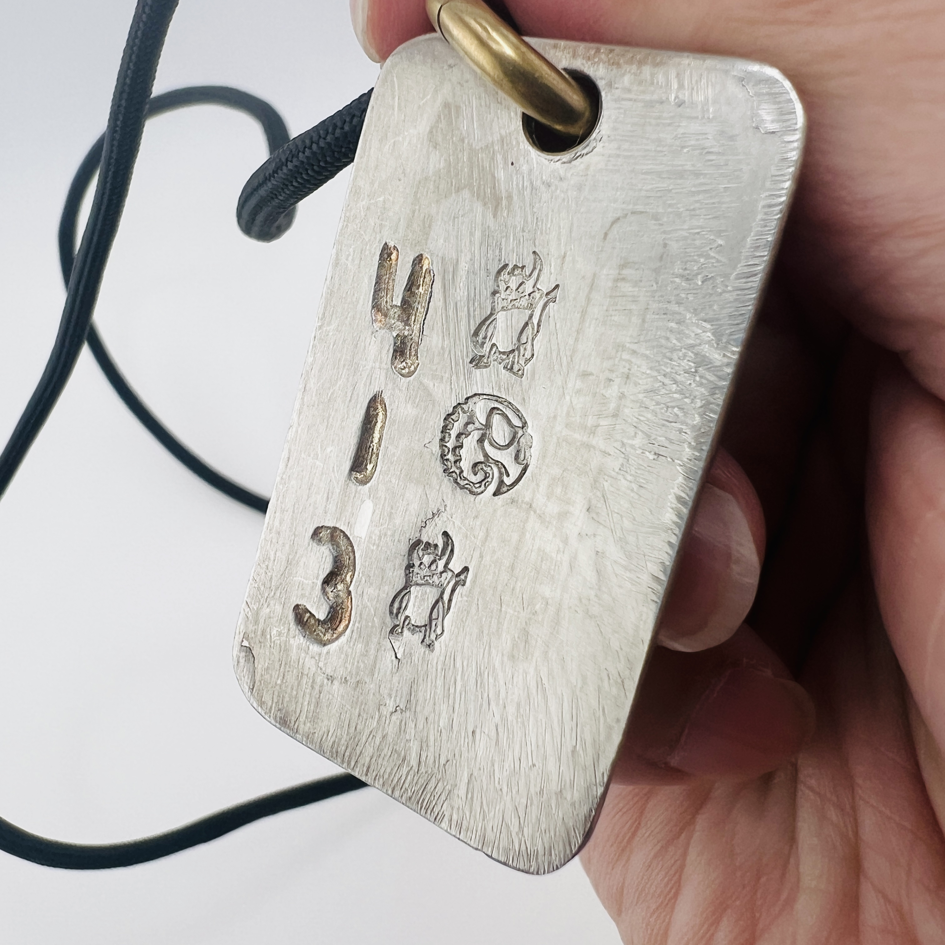 Skull dog tag pendant necklace, made of gun barrel steel