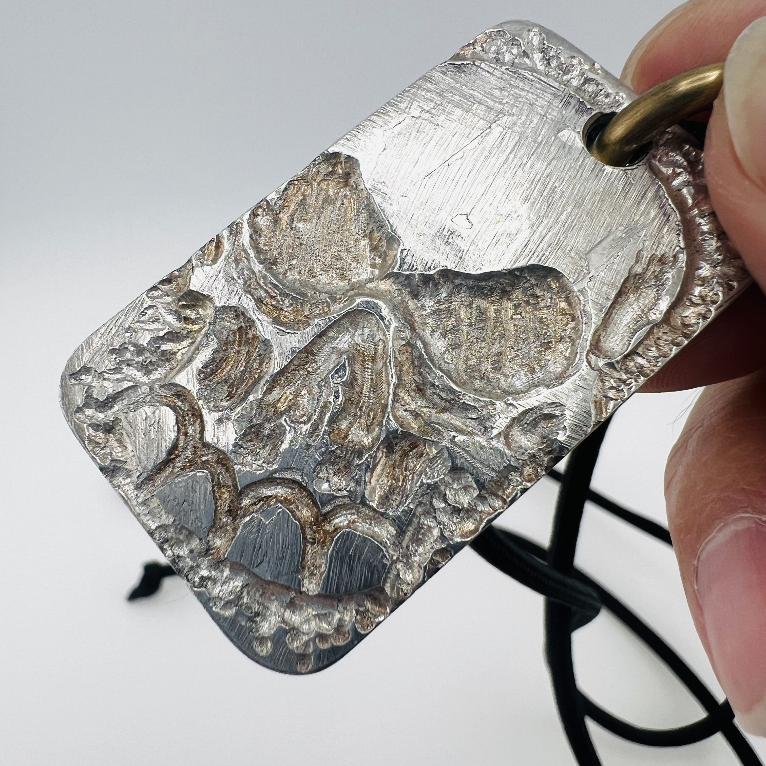 Skull dog tag pendant necklace, made of gun barrel steel