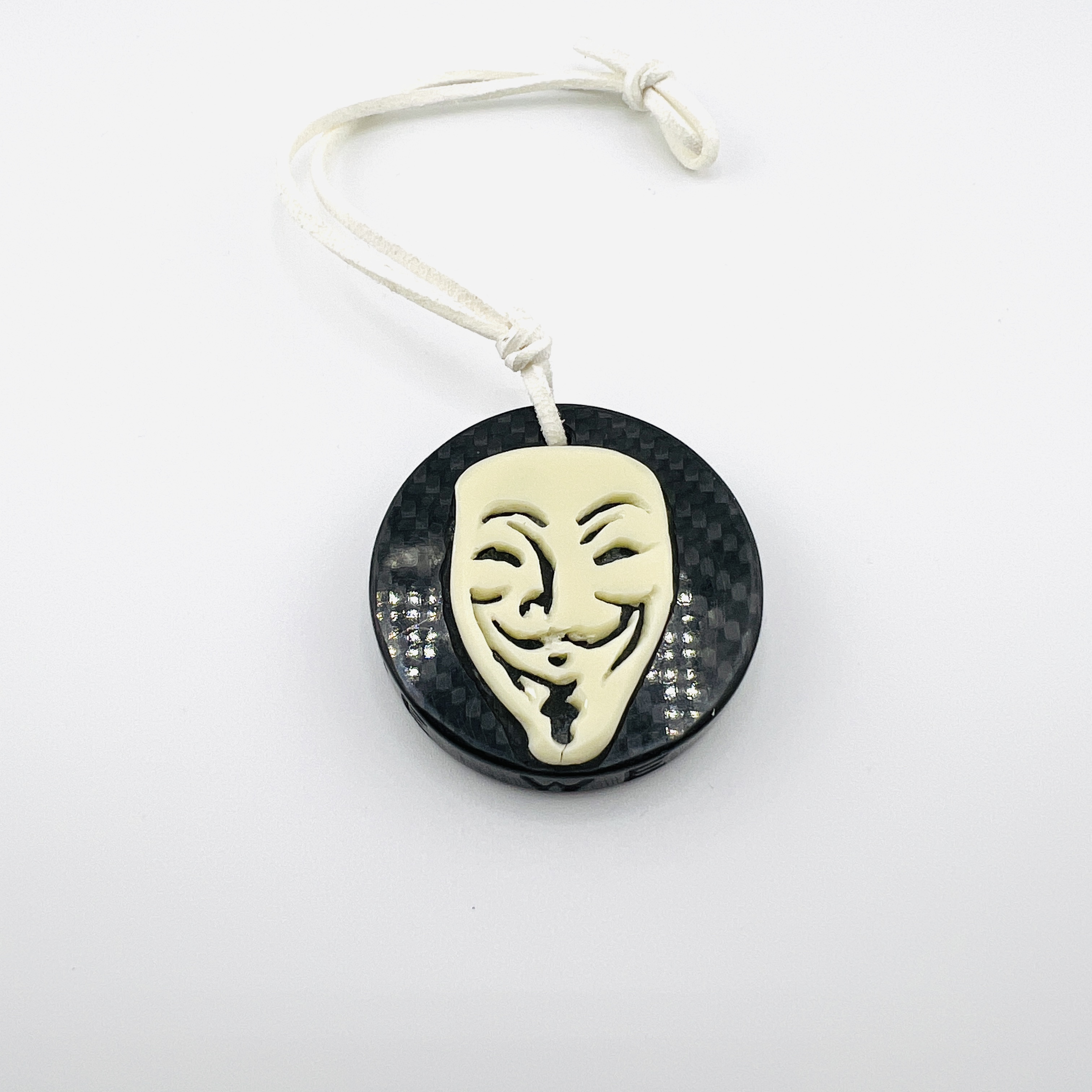Anonymous hacker coin pendant, glow-in-the dark resin and carbon fiber