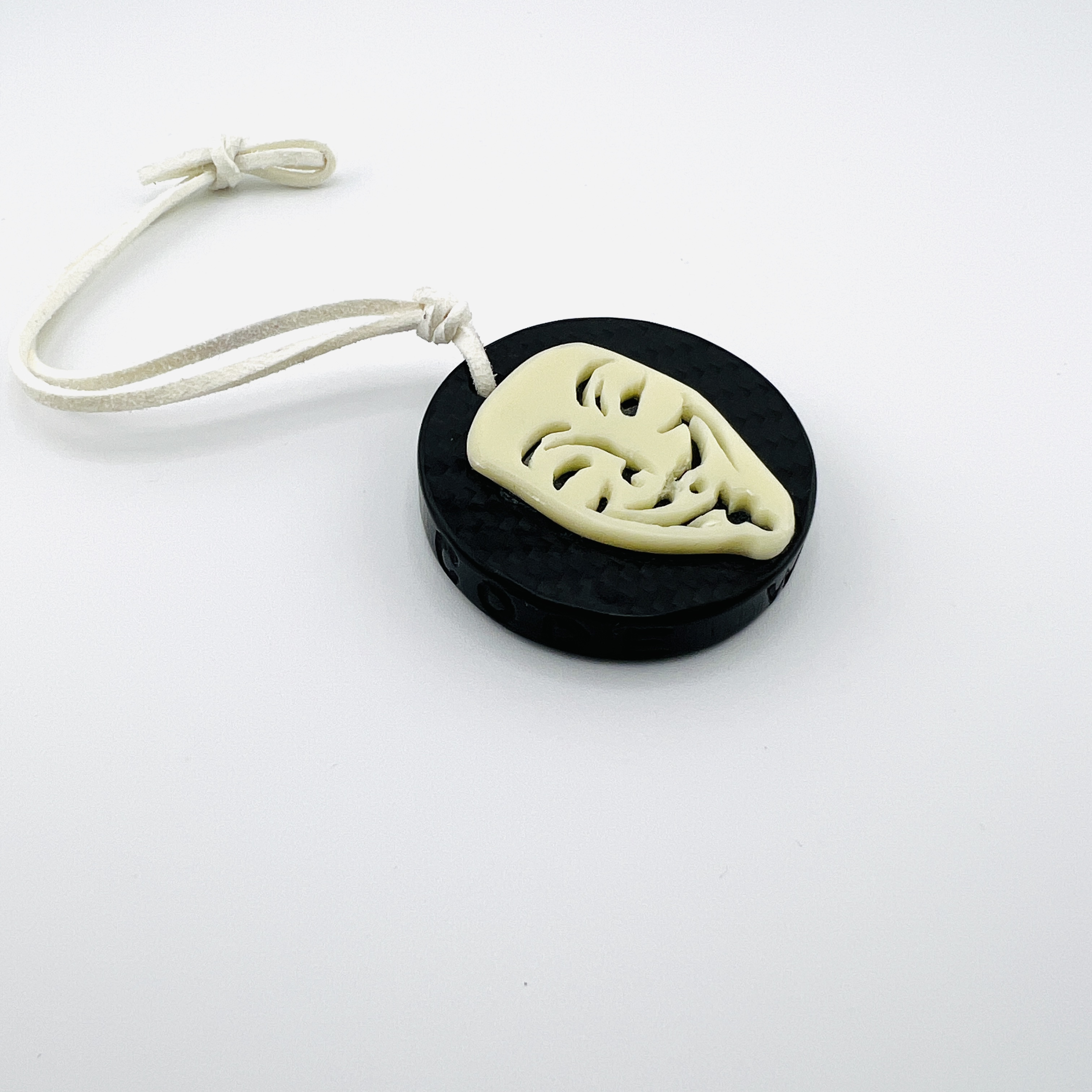 Anonymous hacker coin pendant, glow-in-the dark resin and carbon fiber