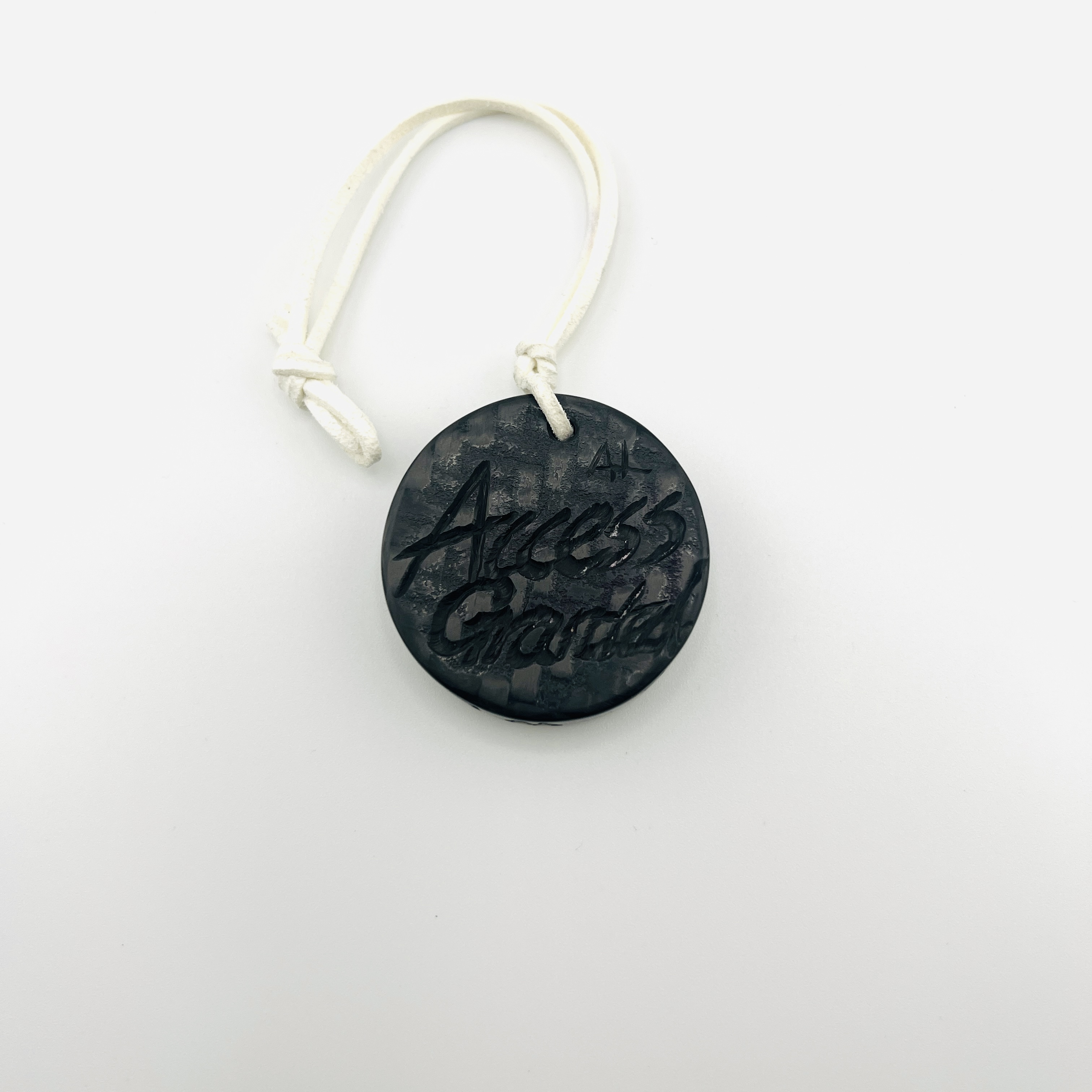 Anonymous hacker coin pendant, glow-in-the dark resin and carbon fiber
