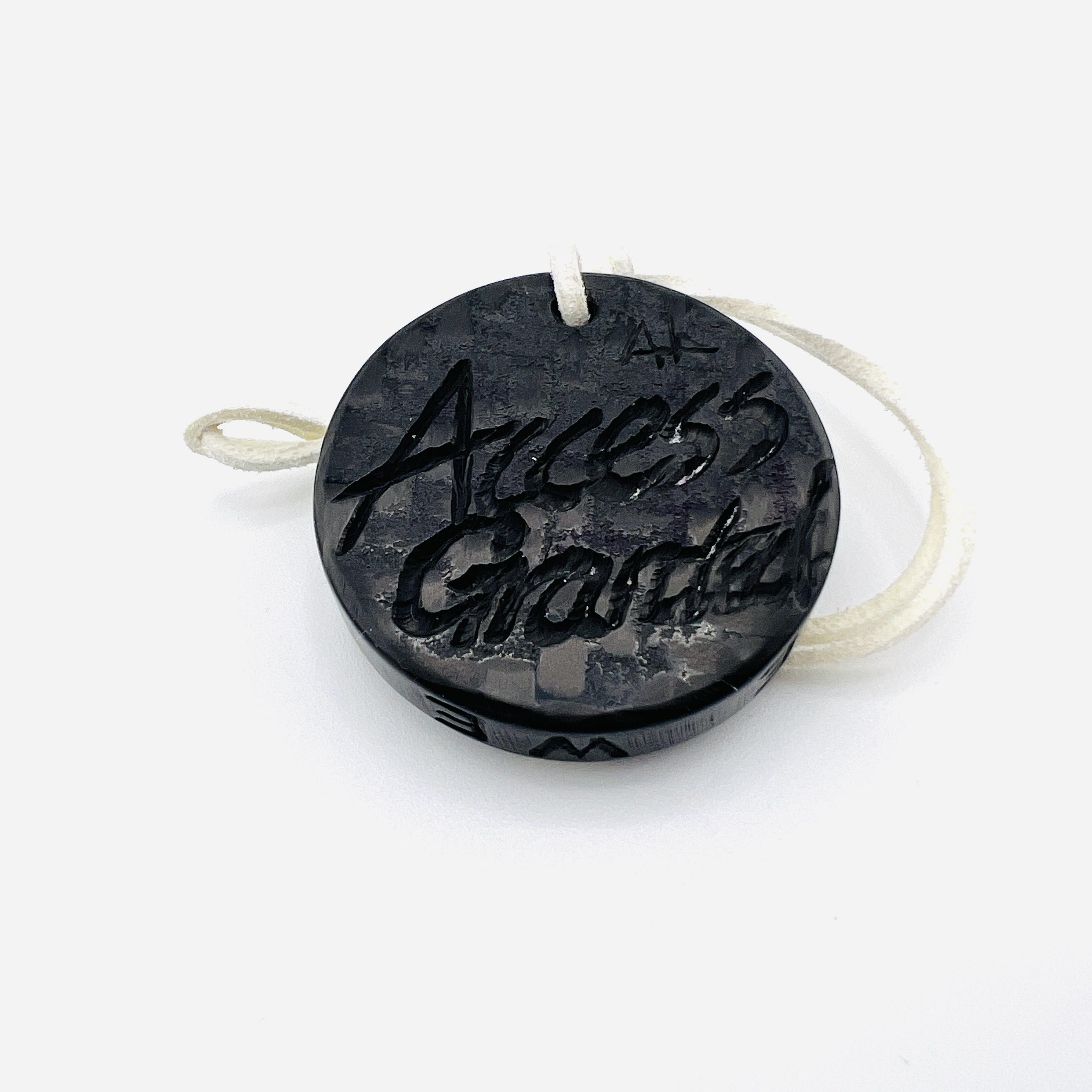 Anonymous hacker coin pendant, glow-in-the dark resin and carbon fiber