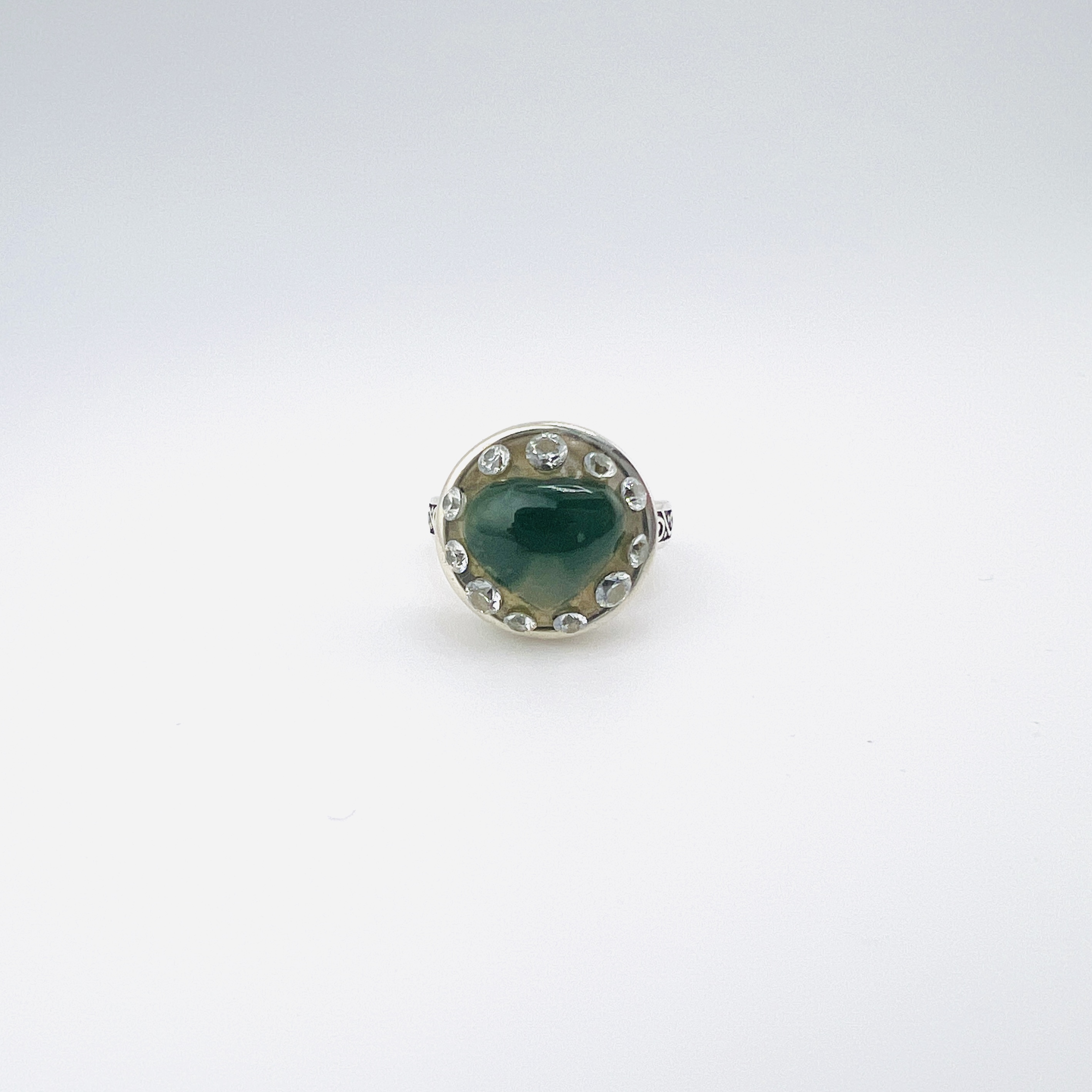 Heart shaped jadeite and diamond ring in silver setting