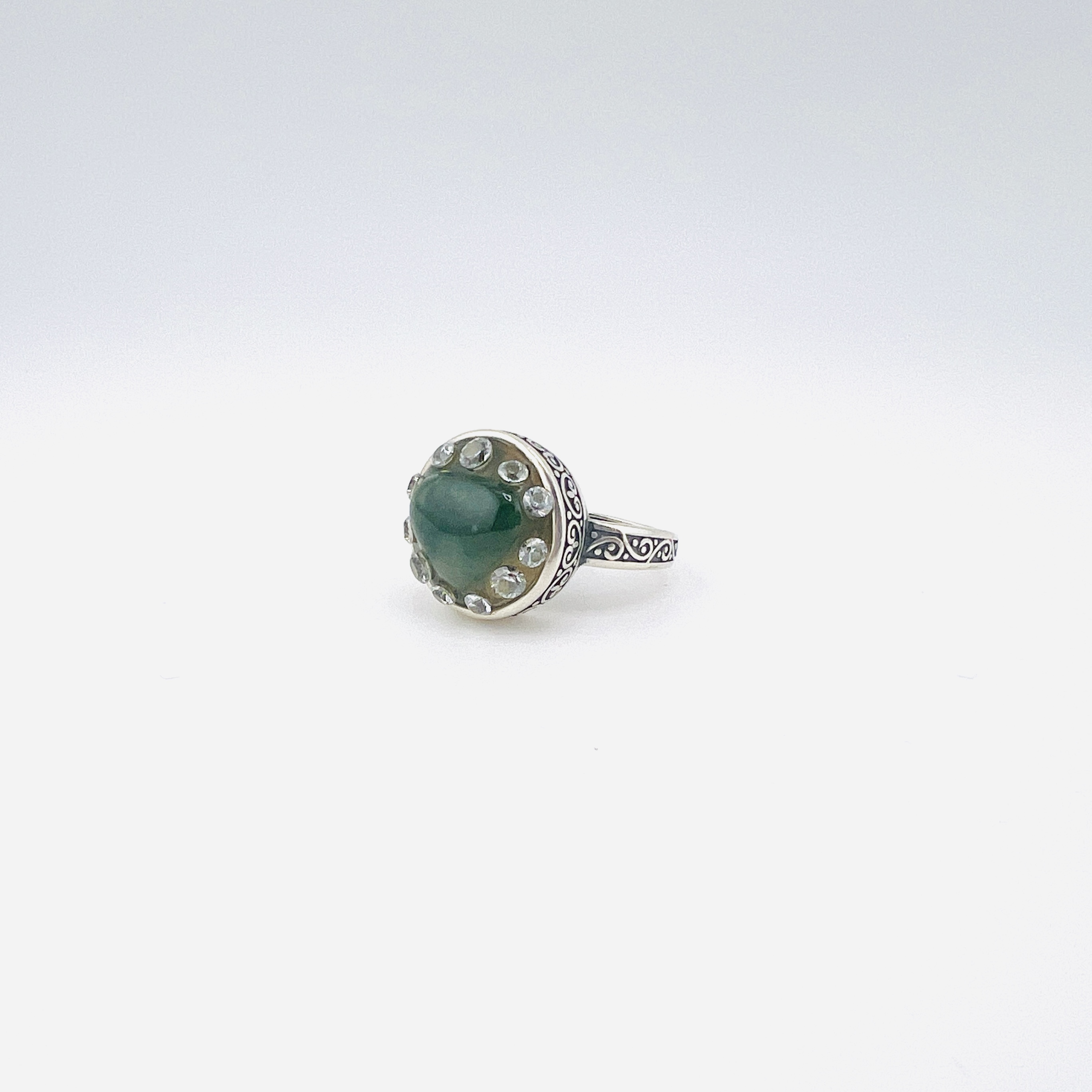 Heart shaped jadeite and diamond ring in silver setting