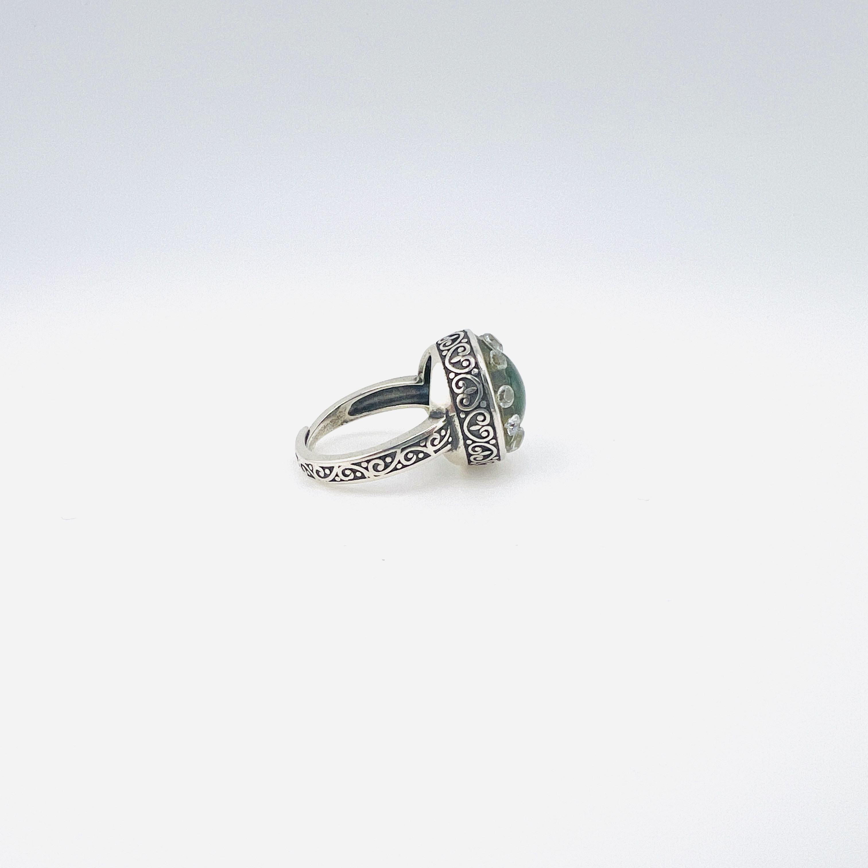 Heart shaped jadeite and diamond ring in silver setting