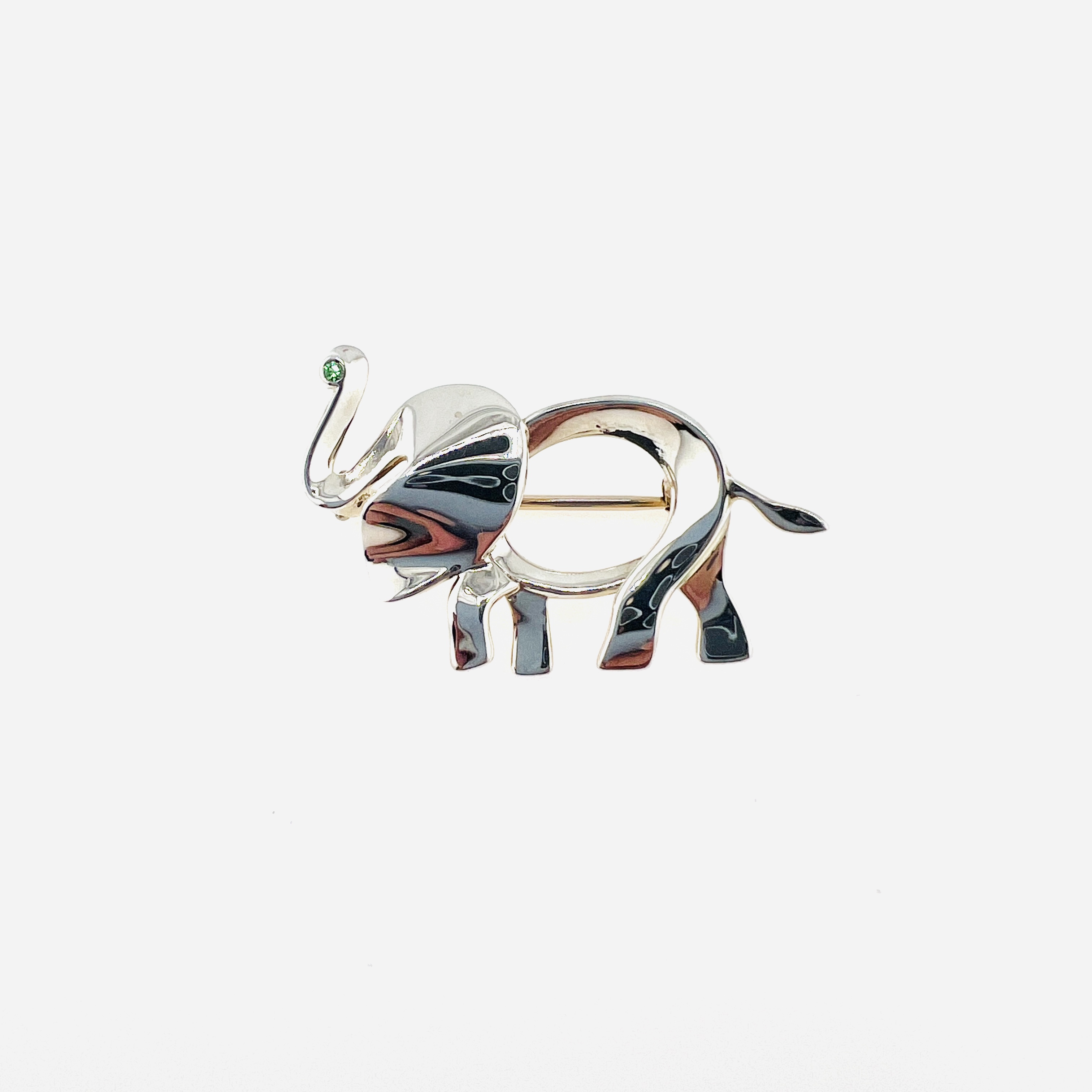 Tiffany & Co. Elephant brooch in sterling silver and green Peridot 