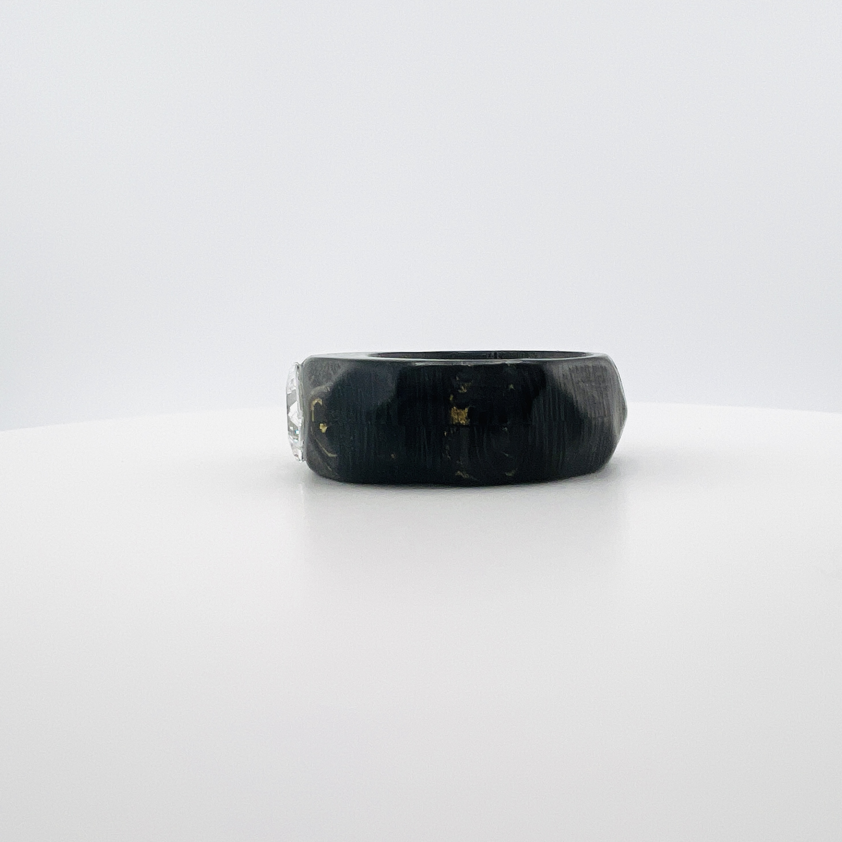 Princess cut diamond ring in carbon fiber band setting
