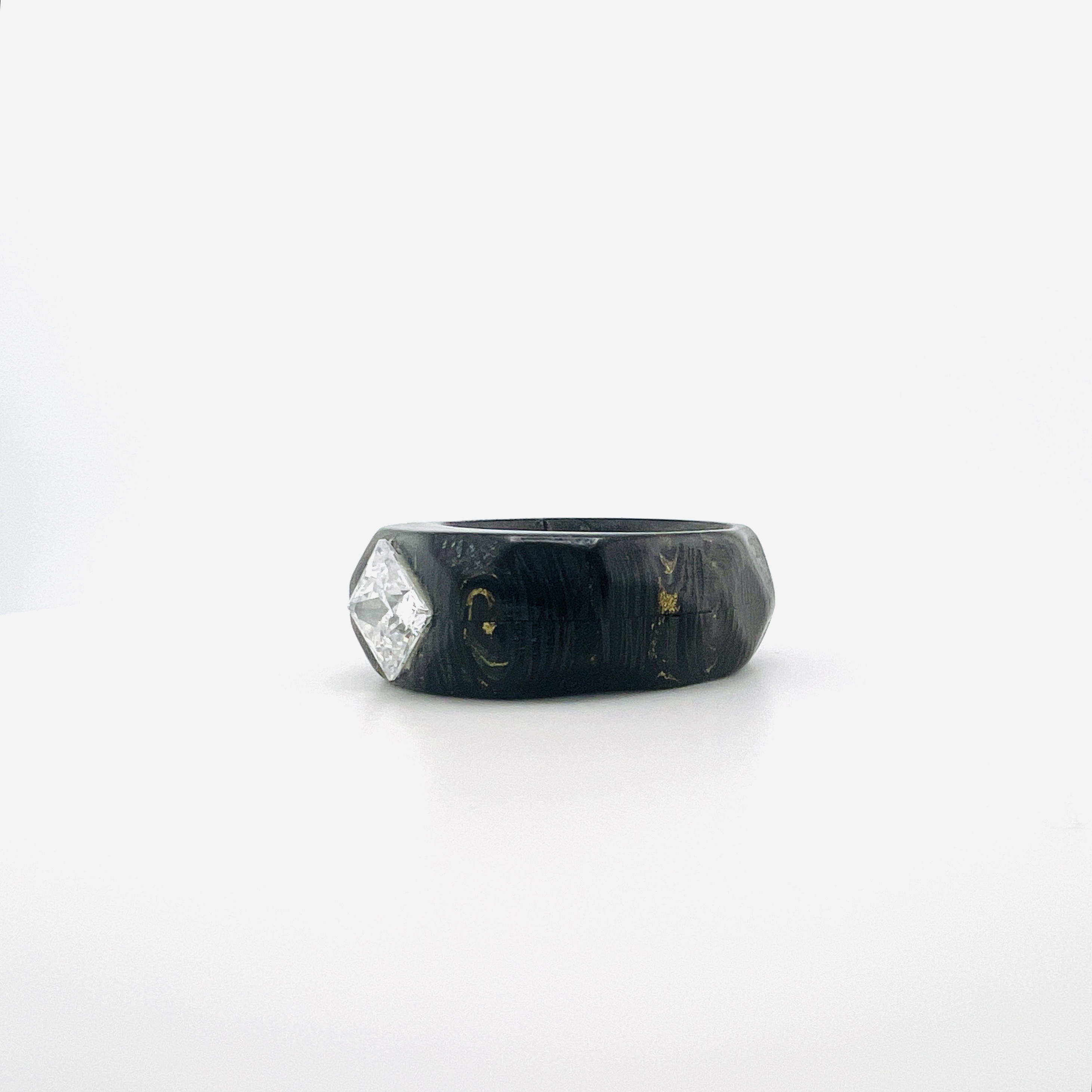 Princess cut diamond ring in carbon fiber band setting