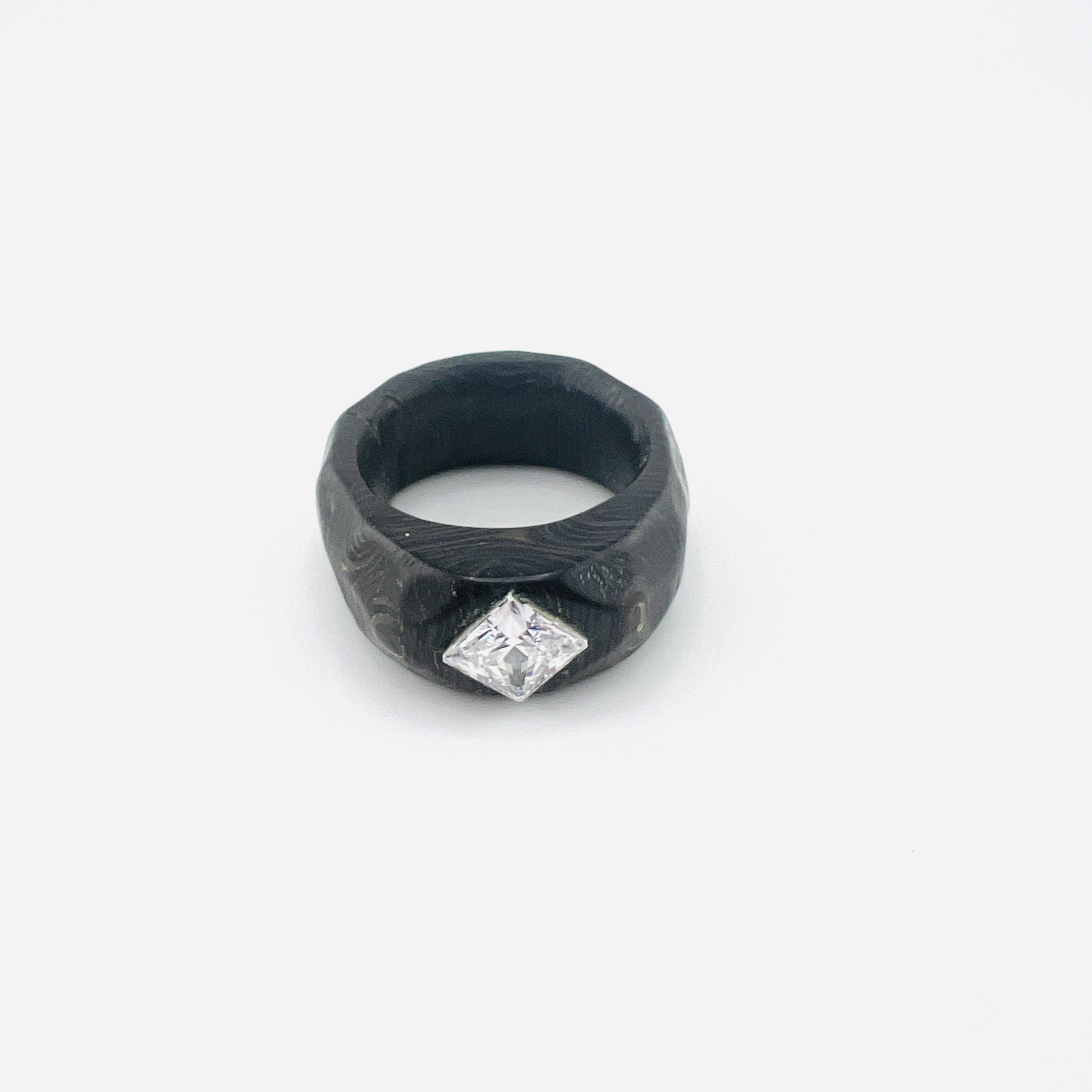 Princess cut diamond ring in carbon fiber band setting