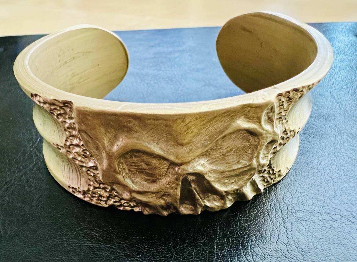 Brass carved skull wide bangle