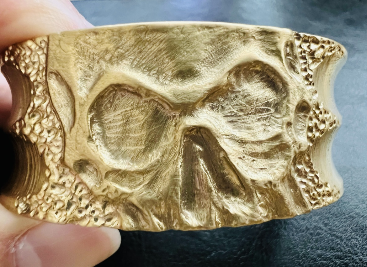 Brass carved skull wide bangle