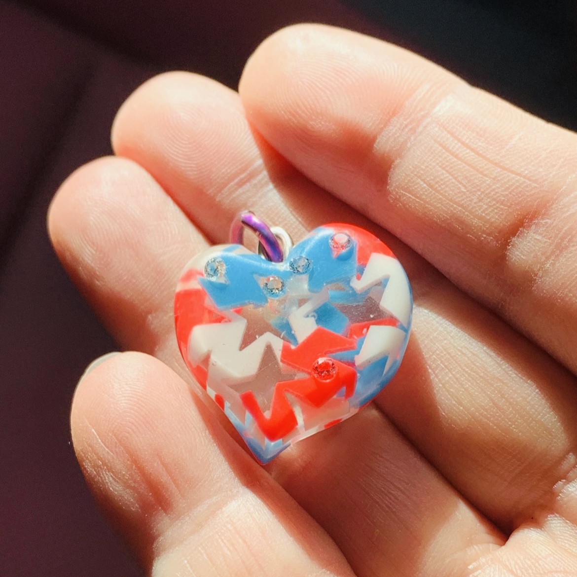 The star in heart pendant, glow in the dark with tri-color stars