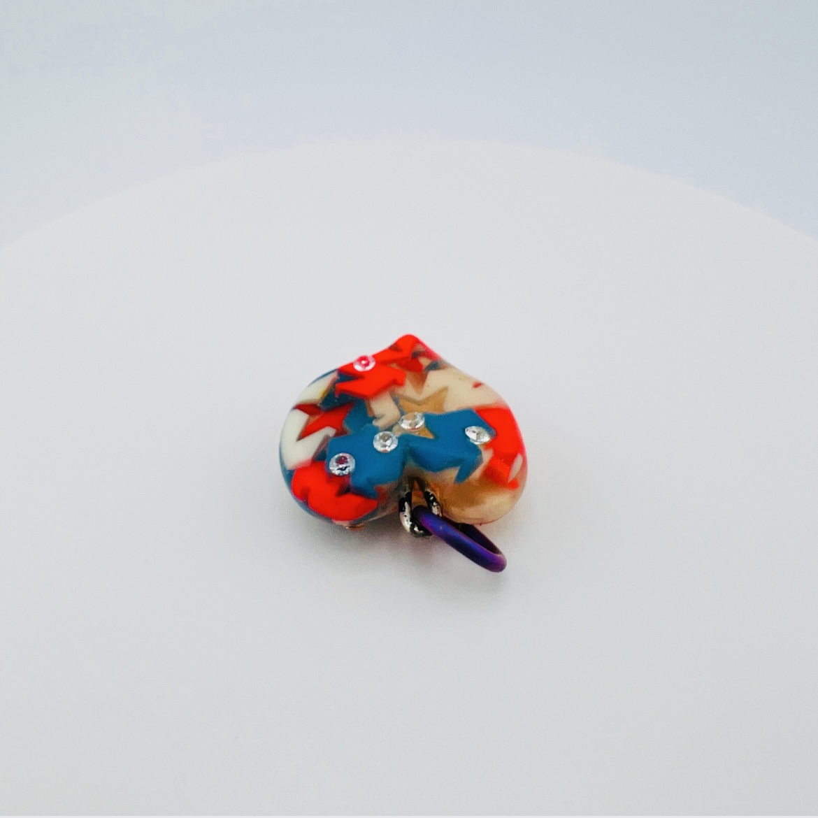 The star in heart pendant, glow in the dark with tri-color stars