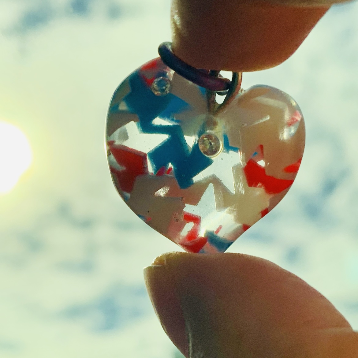 The star in heart pendant, glow in the dark with tri-color stars